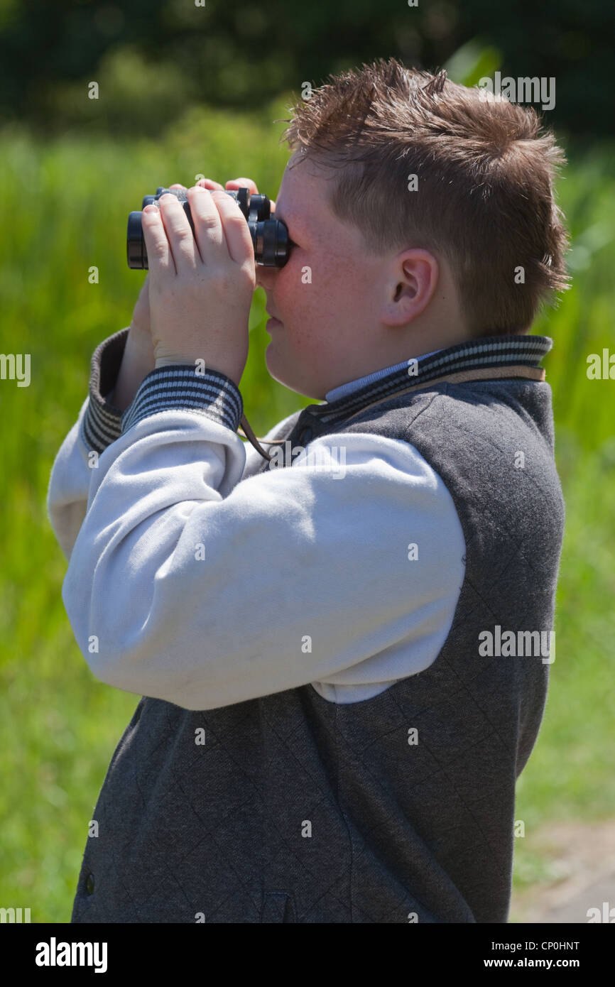 Young Bird Watcher with binoculars. London Wetlands Centre. Wildfowl and Wetlands Trust. Barnes. London. Stock Photo