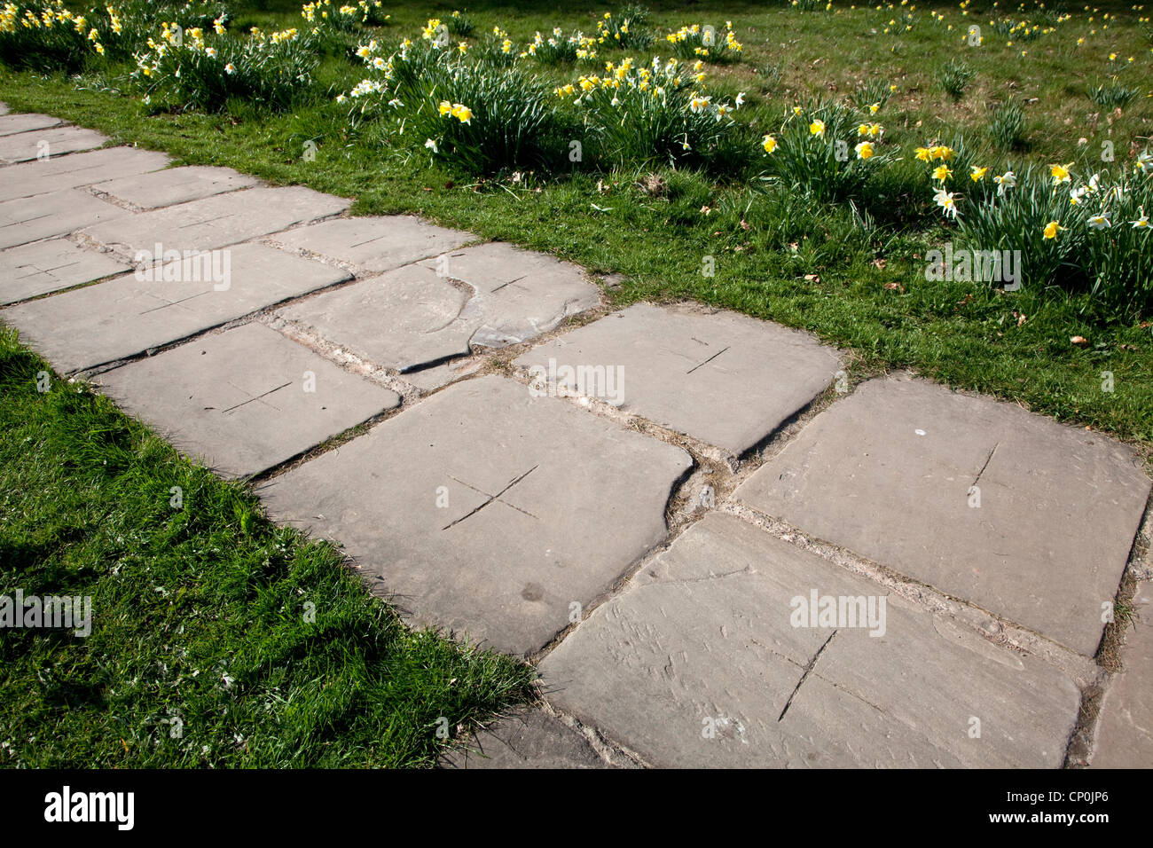 Yorkshire Paving Stones marked with a cross to avoid being stolen by thieves. Stock Photo