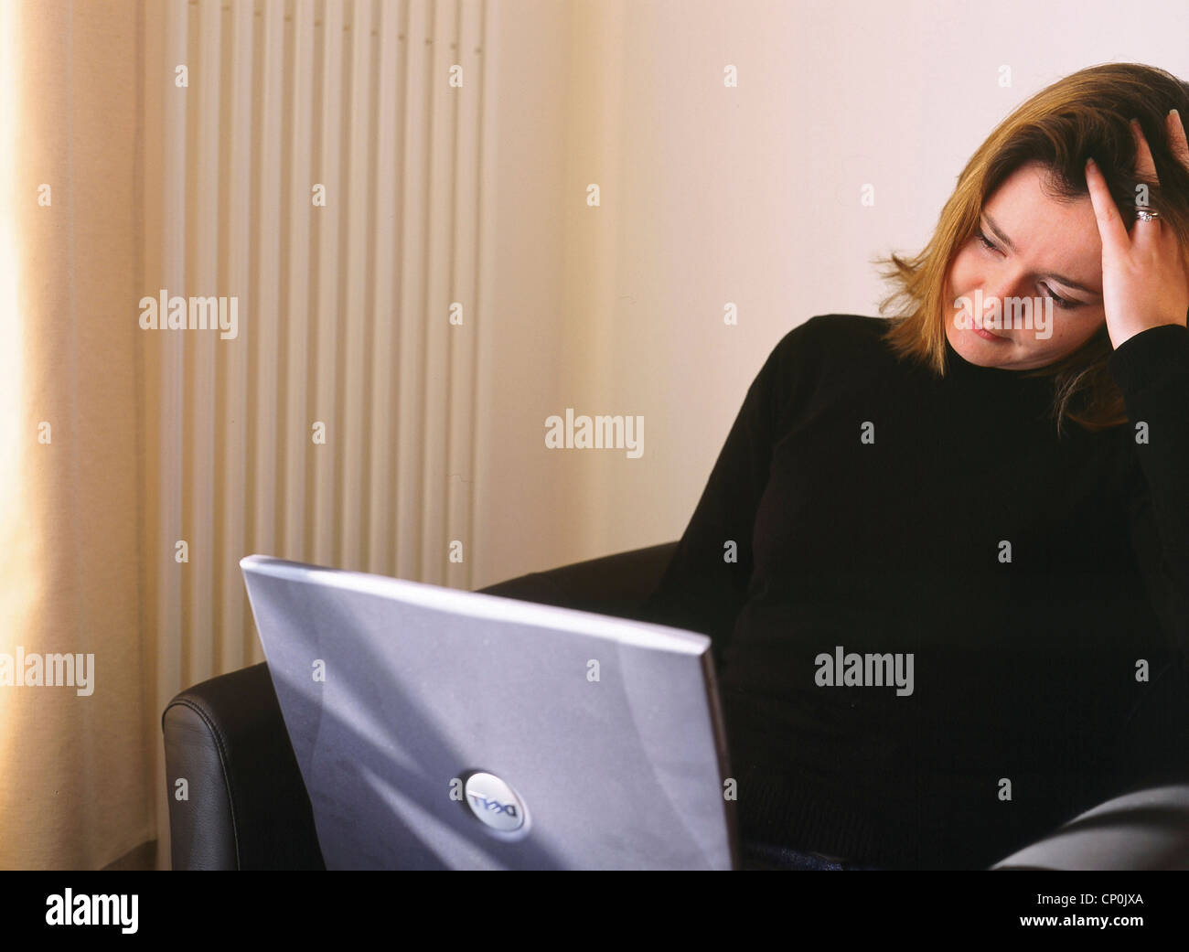 Young woman in her thirties with laptop. Stock Photo