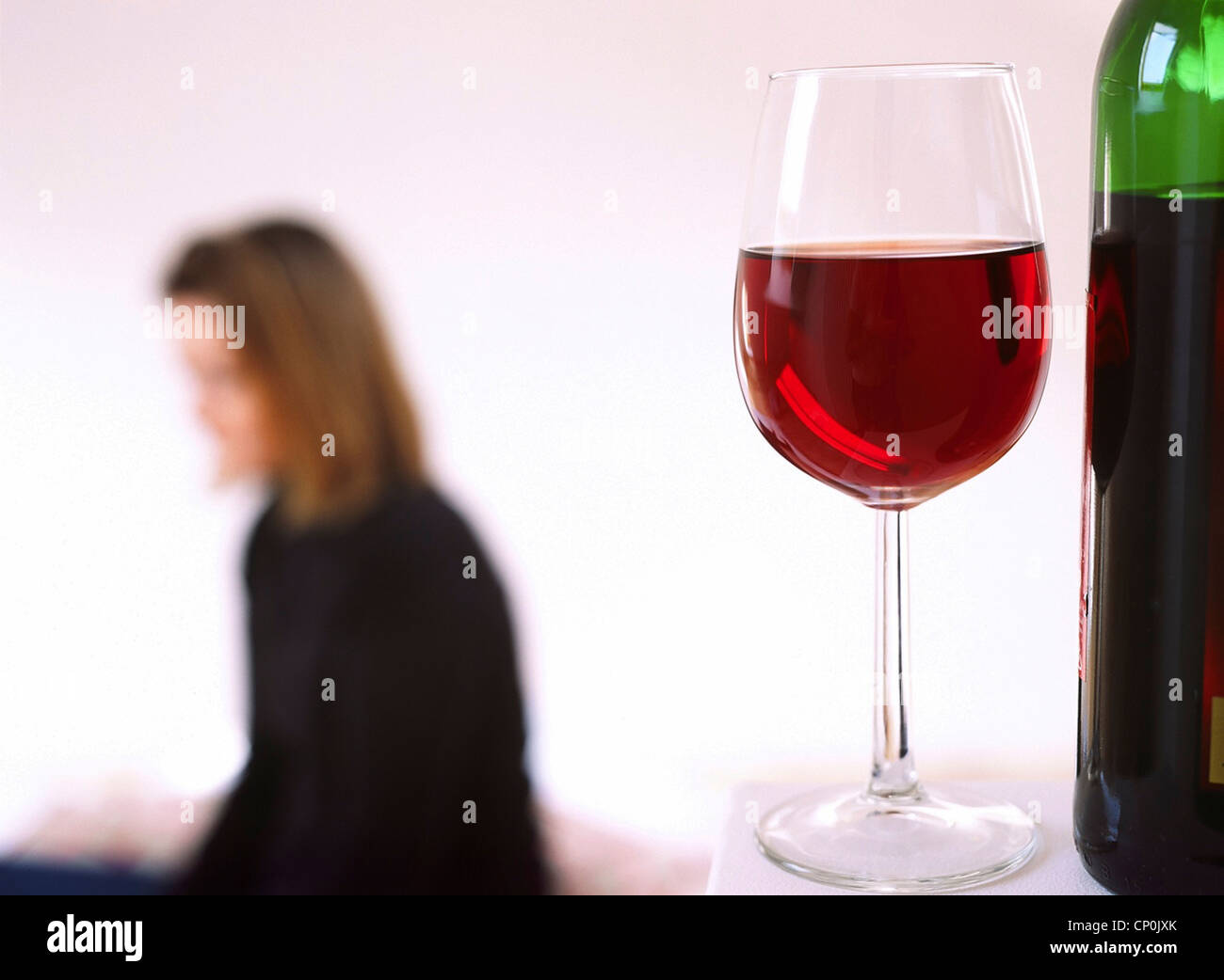 Female in her thirties with glass of wine. Stock Photo