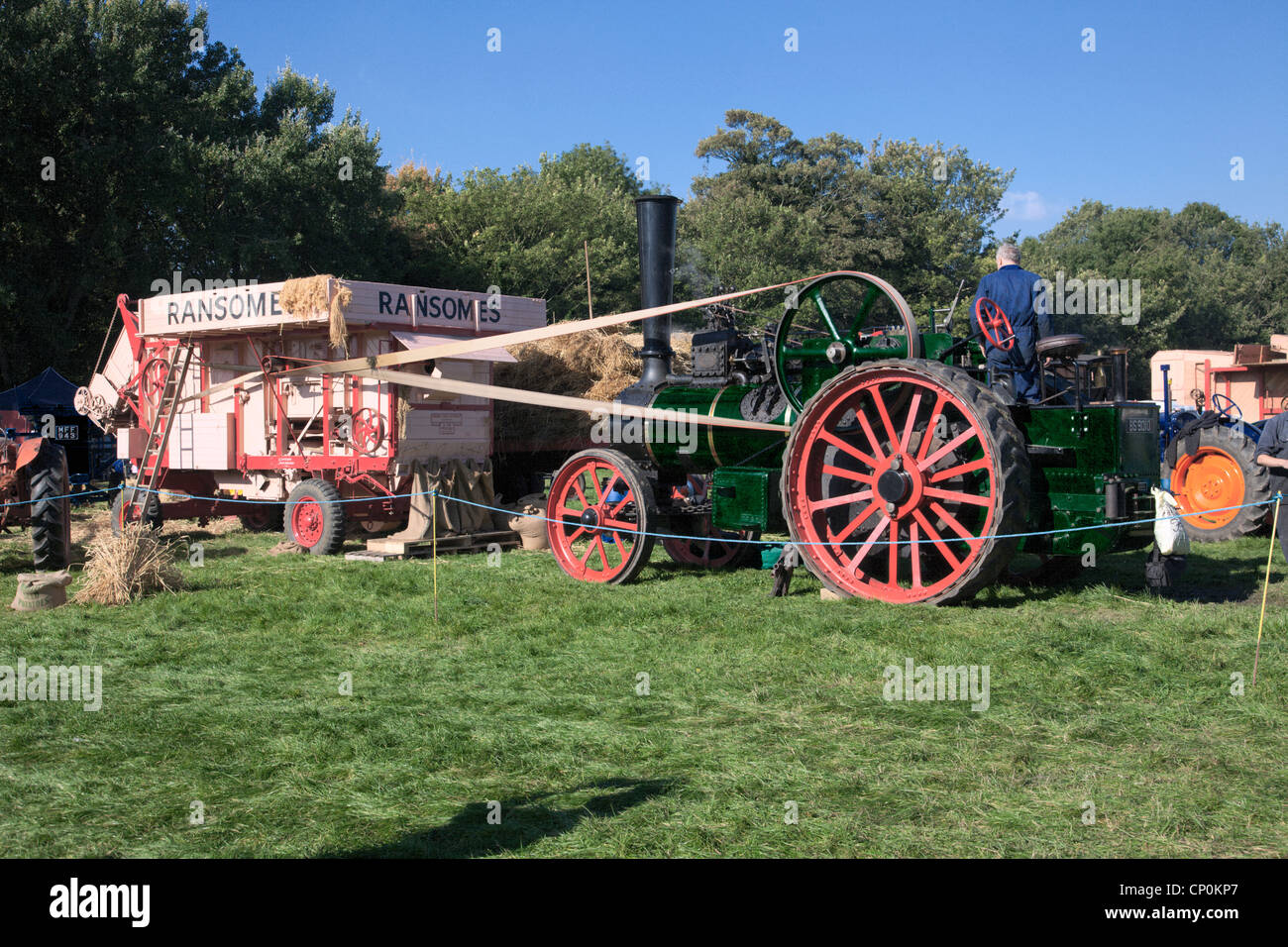 Agricultural machinery driven by steam traction engine Stock Photo Alamy