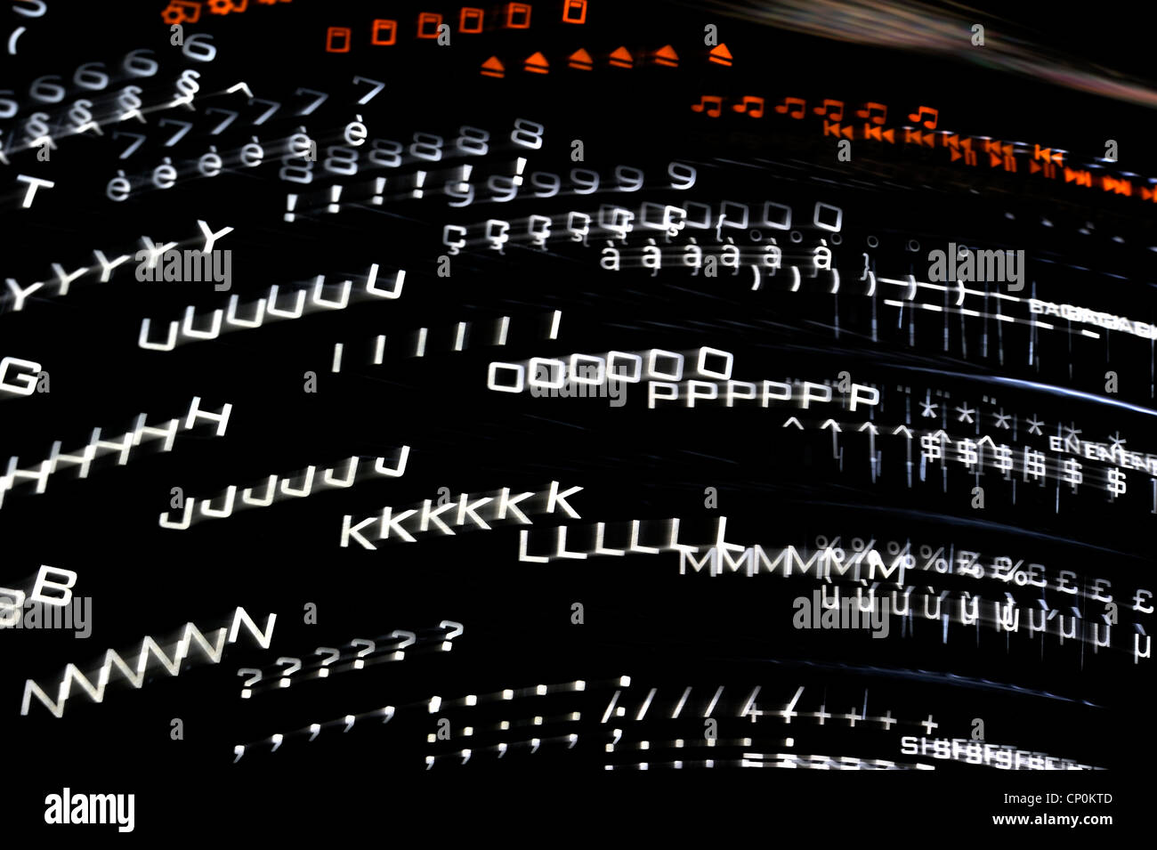 Abstract technology image showing black computer keyboard with illuminated backlit white letters on keys Stock Photo
