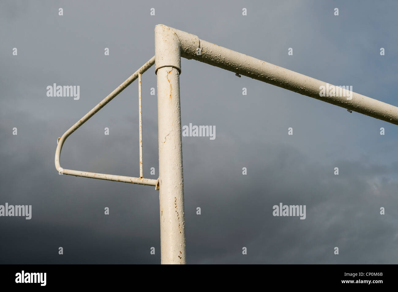 Detail of football goal post and crossbar against moody sky Stock Photo
