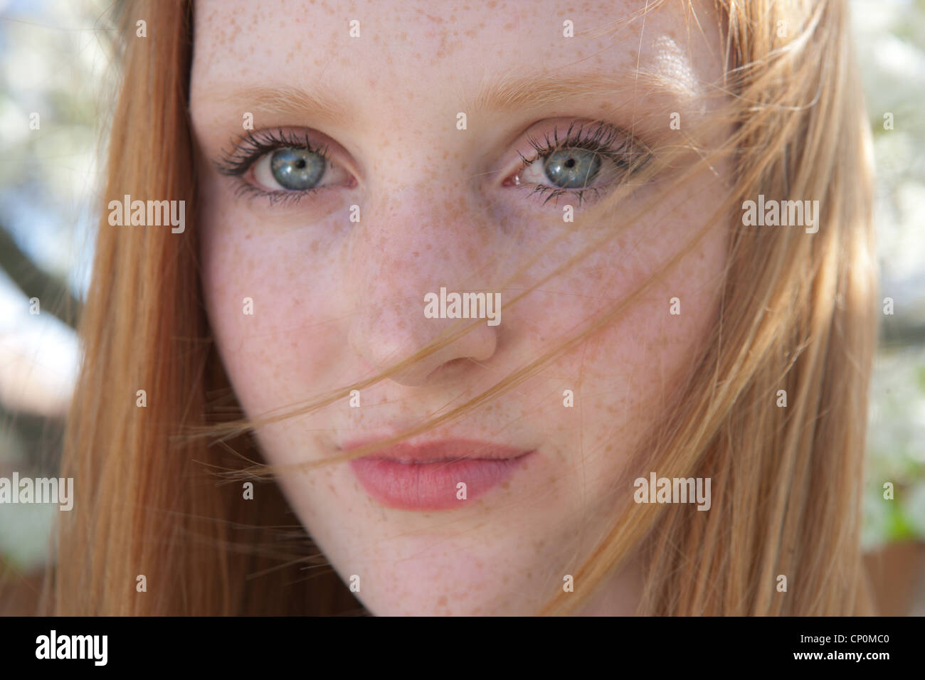 Close Up Of Pretty Teenage Girl With Red Hair And Green Eyes Stock
