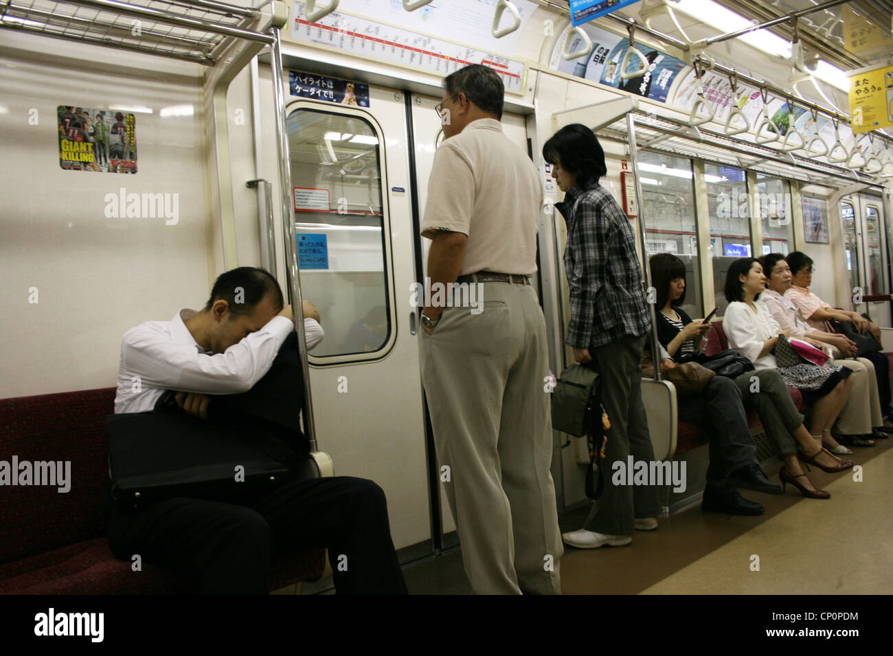People Waiting For Doors To Open On A Subway Train Tokyo Japan