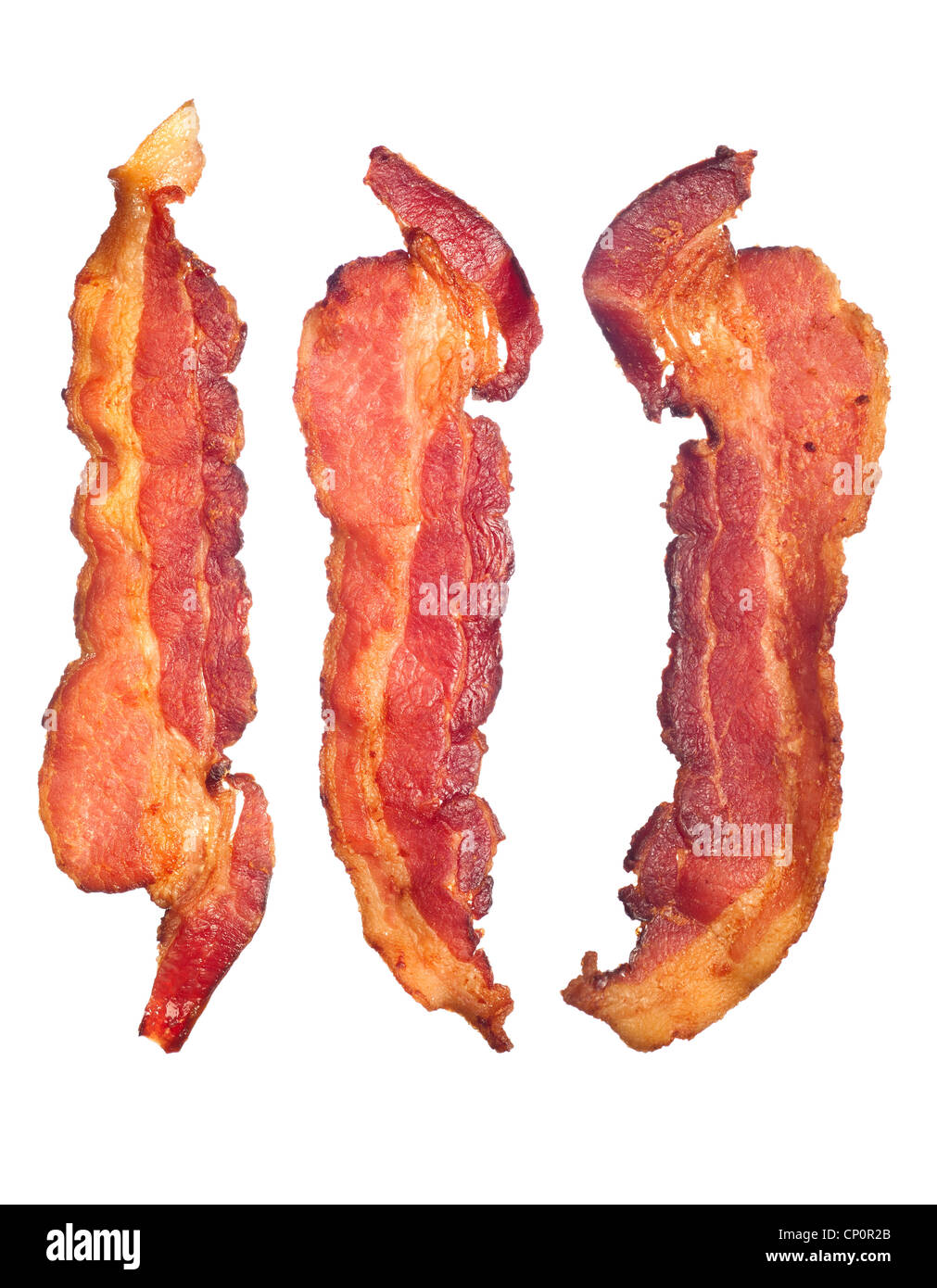Three cooked, crispy fried bacon isolated on a white background. Good for many health and cooking inferences. Stock Photo