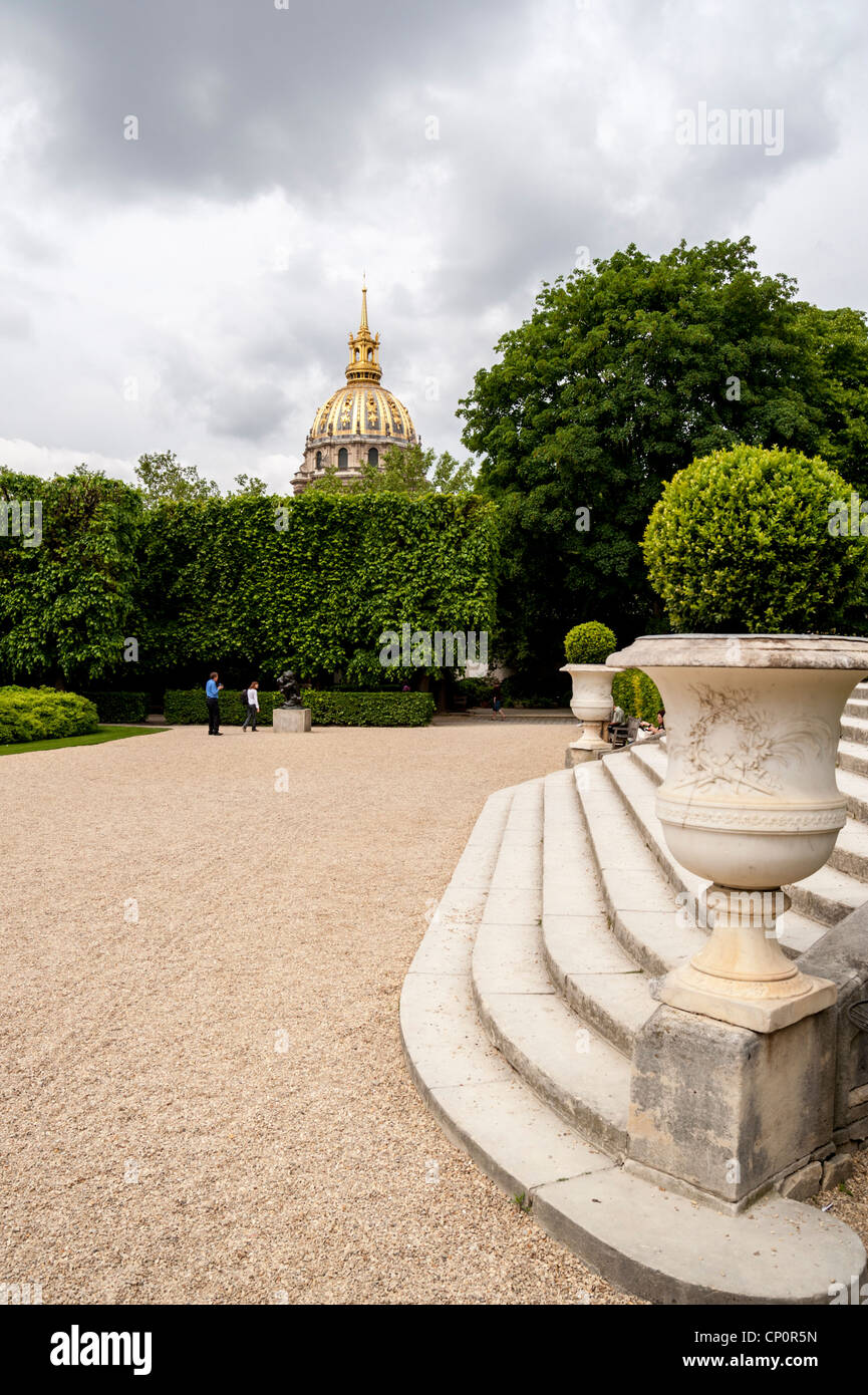 View from inside the Rodin museum garden toward the dome of Les Invalides. Paris, France. Stock Photo