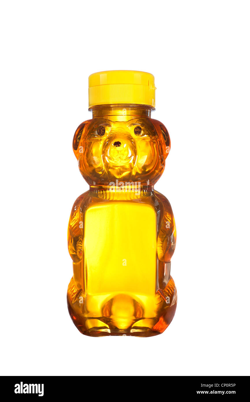 A fresh bottle of natural honey in a bear shaped container isolated on white Stock Photo
