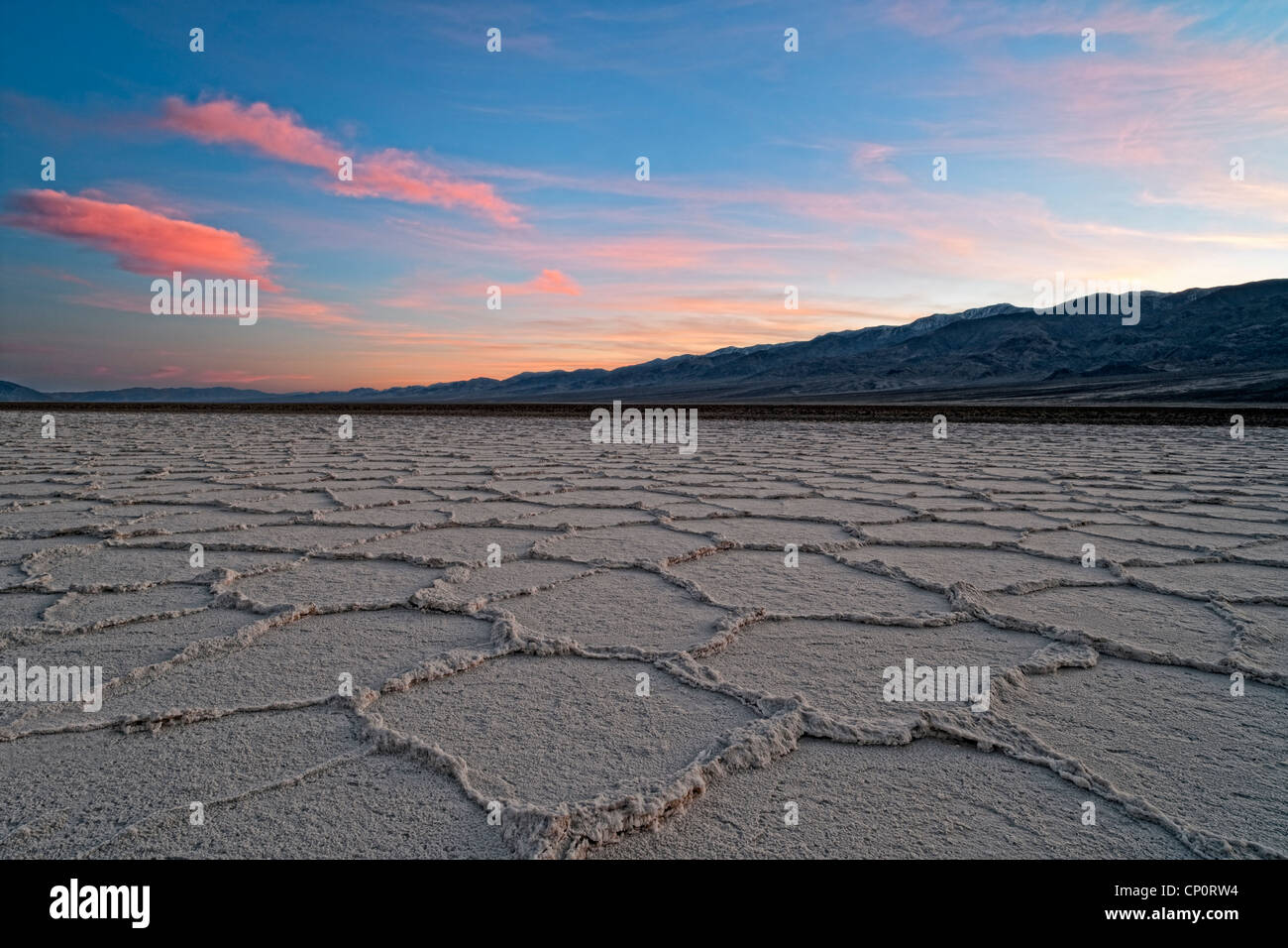 Winter sunset over the Panamint Range and the salt polygons of Badwater Basin in California's Death Valley National Park. Stock Photo
