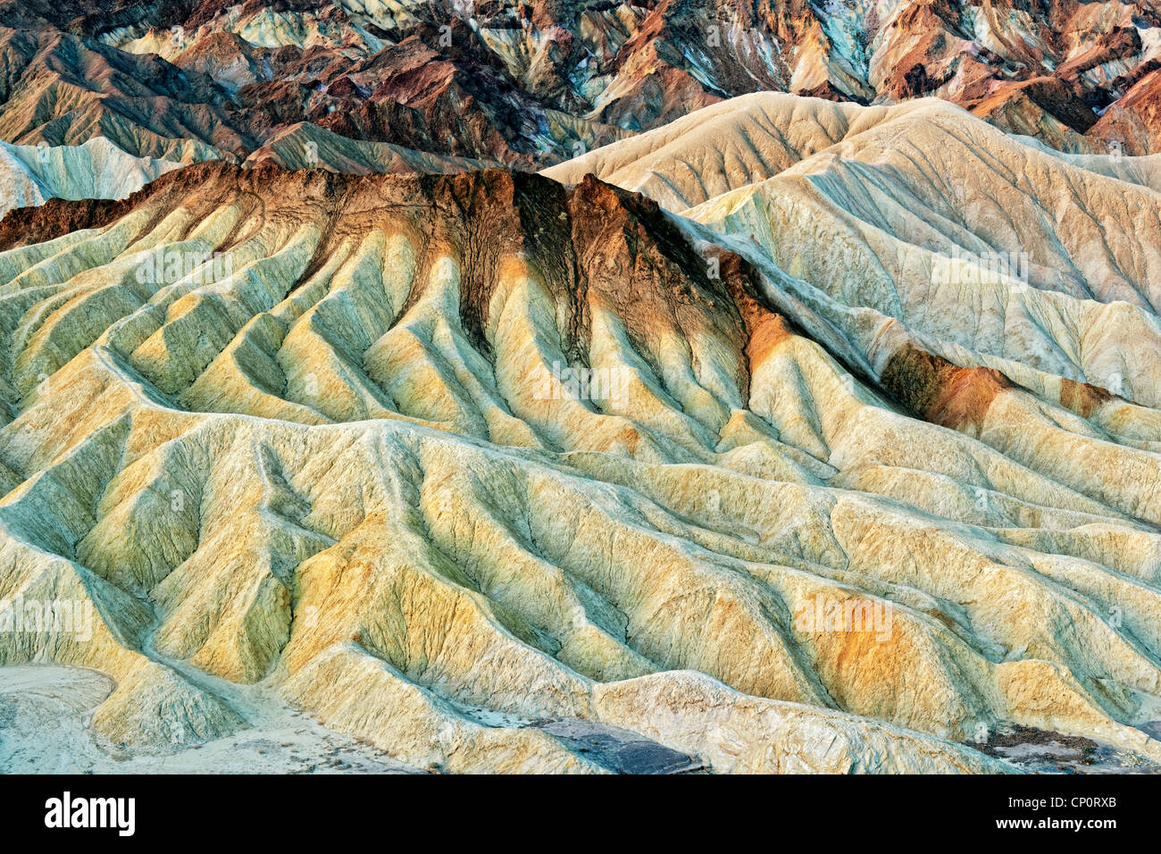 The undulating multicolored badlands of Golden Canyon in California’s Death Valley National Park. Stock Photo