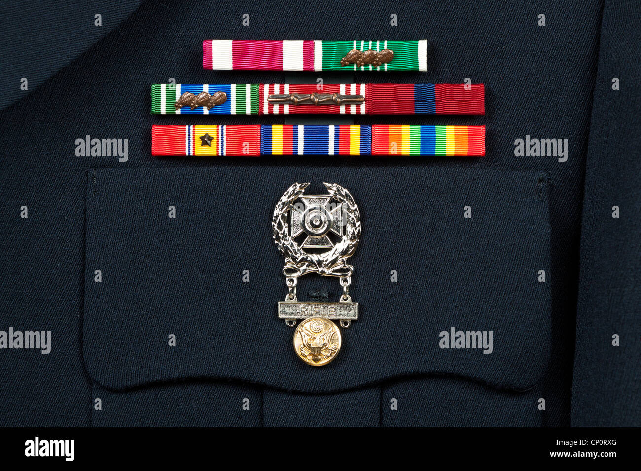 Service award ribbons and marksman badge on U.S. military dress uniform