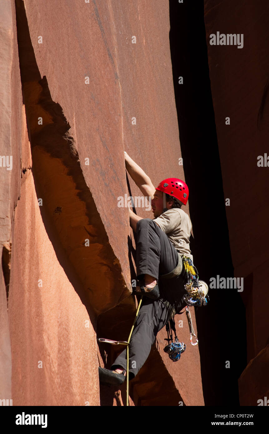 a man crack rock climbing at Indian Creek Utah Stock Photo