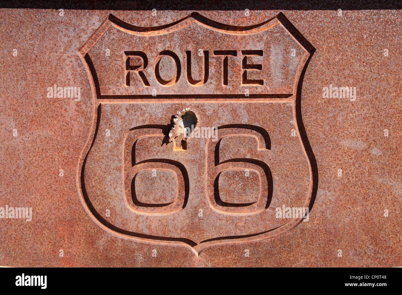 rusty steel route 66 sign with bullet hole Stock Photo