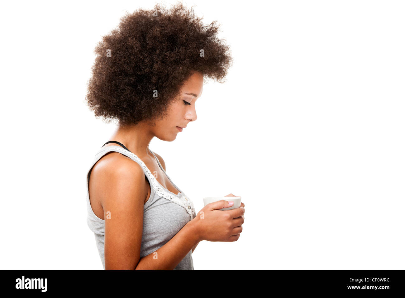 Beautiful young woman holding a cup of coffee, isolated on white Stock ...