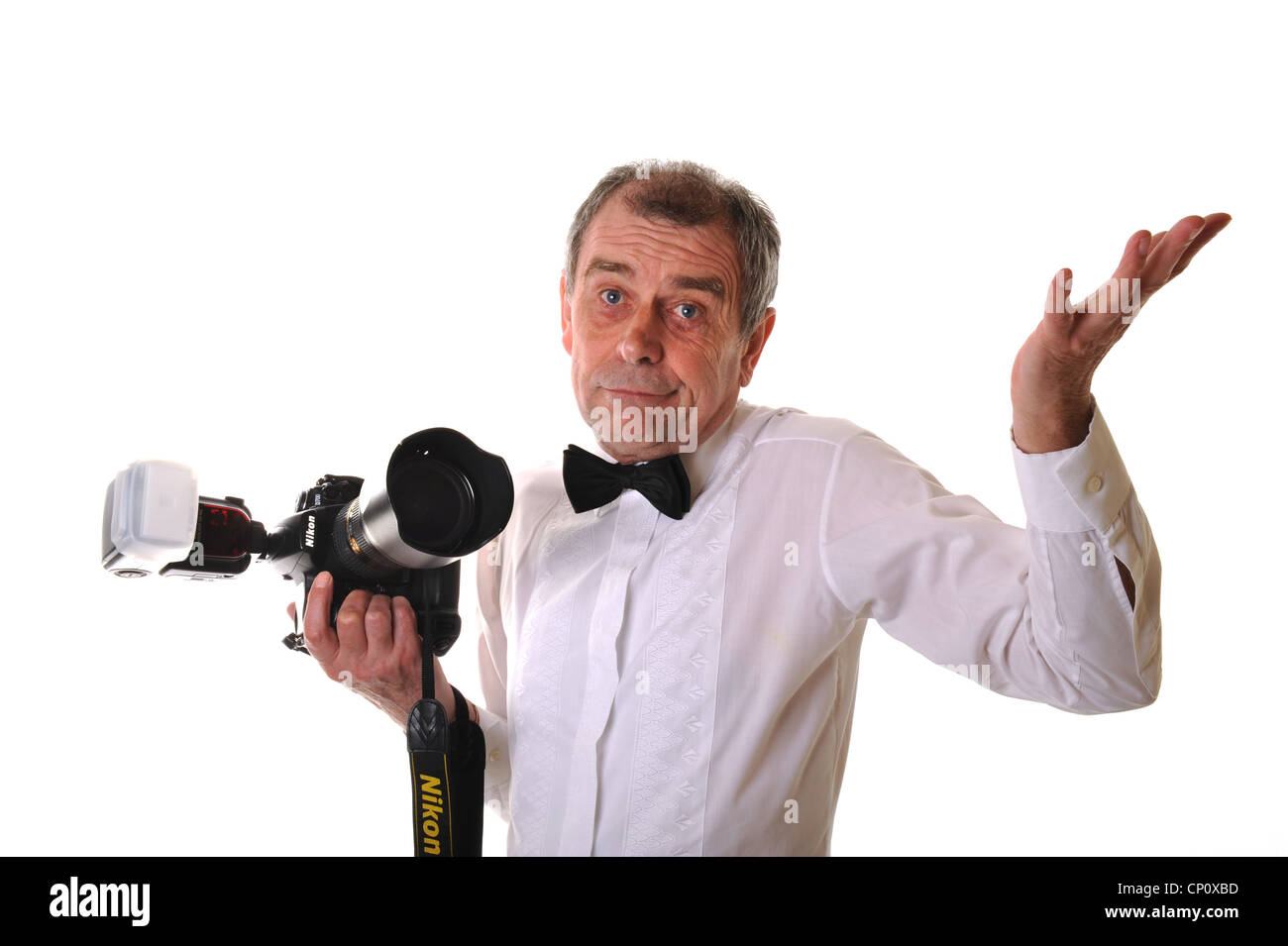 Photographer dressed in black tie Uk Stock Photo