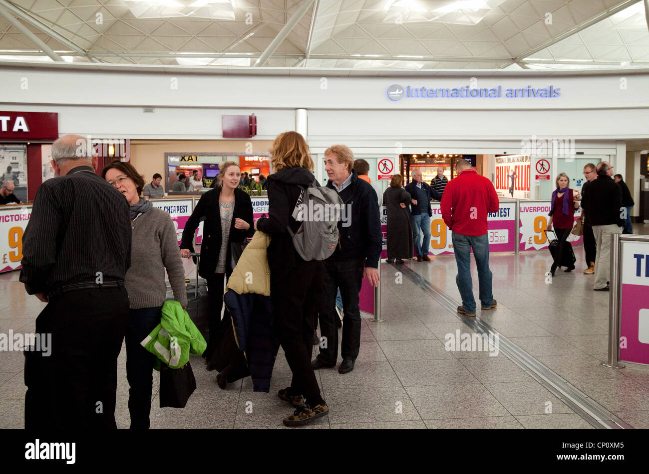 People at the International Arrivals department, Stansted Airport Essex UK Stock Photo