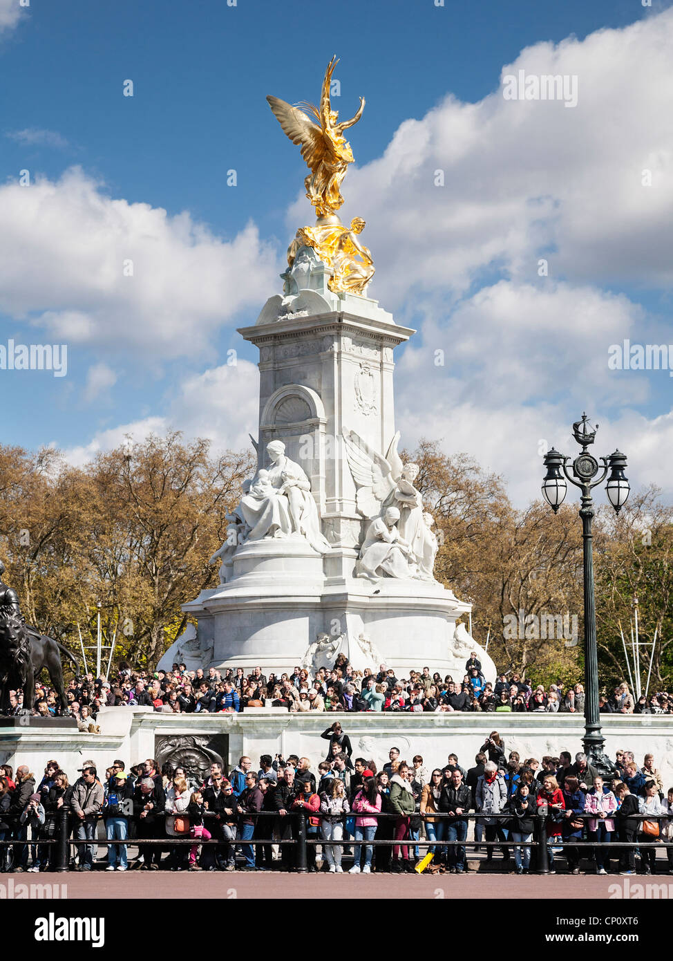 A crowd gathered on the Queen Victoria memorial, The Mall, London, England Stock Photo