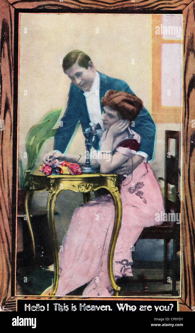 Hello, this is heaven. Who are you? Vintage post card showing woman on phone while man looks on Stock Photo