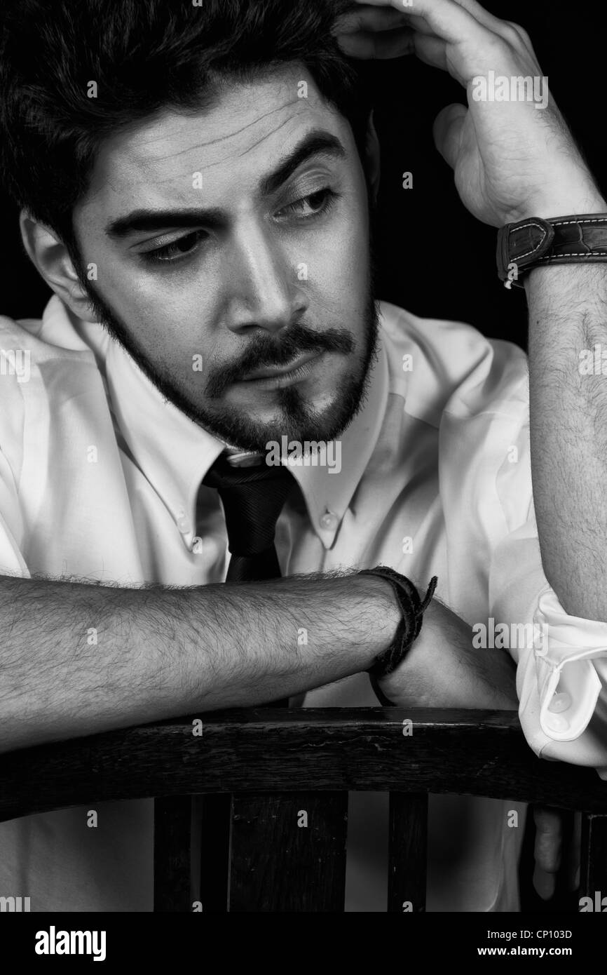 young successful business man with a suit isolated on black background ...
