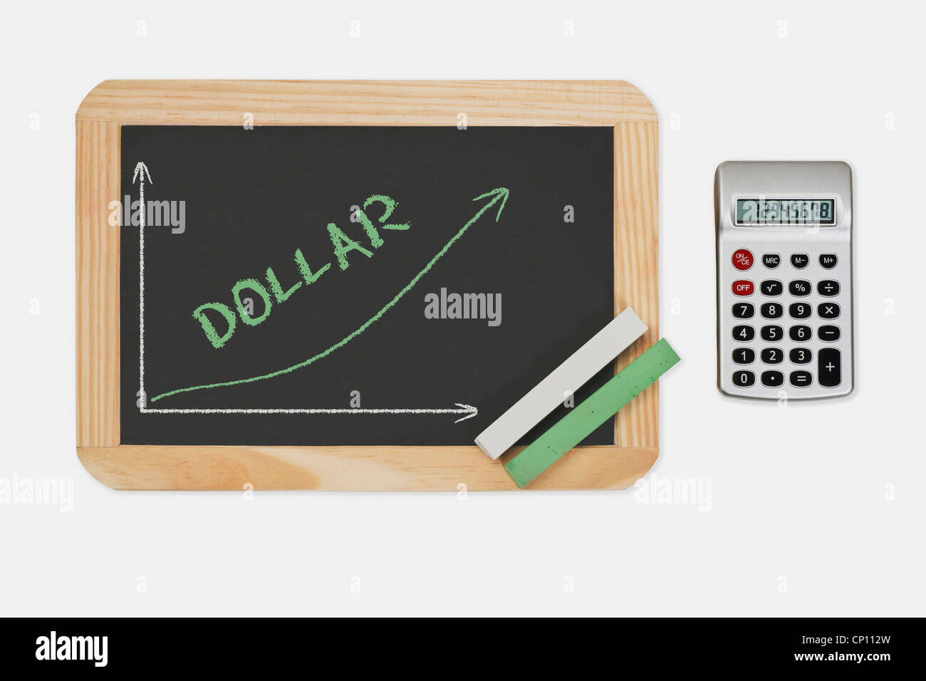 Chalkboard, a chart with an increasing curve. On the chalkboard is the word Dollar written. Pocket calculator at the right side. Stock Photo