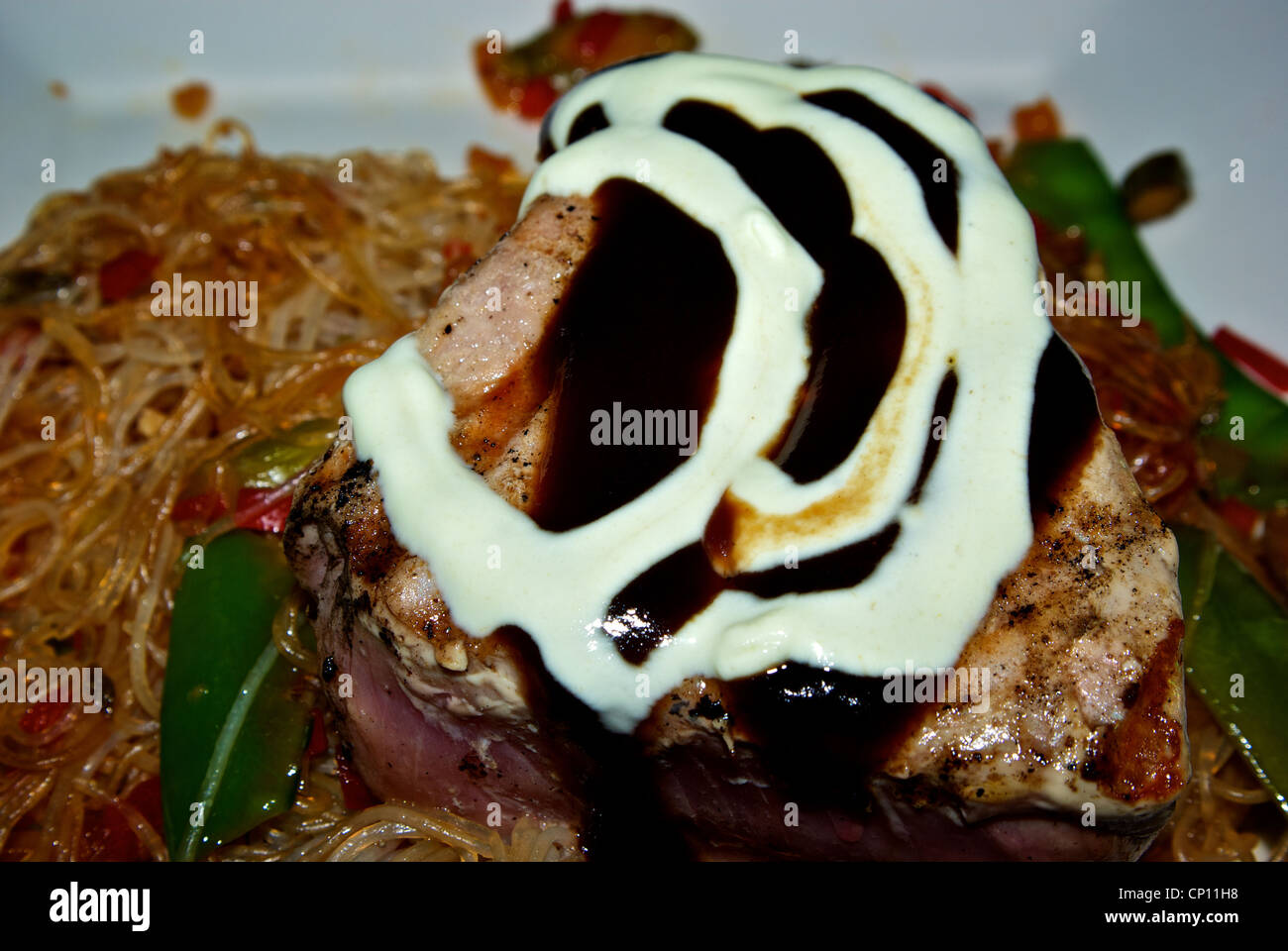 Rare grill seared Asian glazed Yellowfin tuna fillet wasabi cream