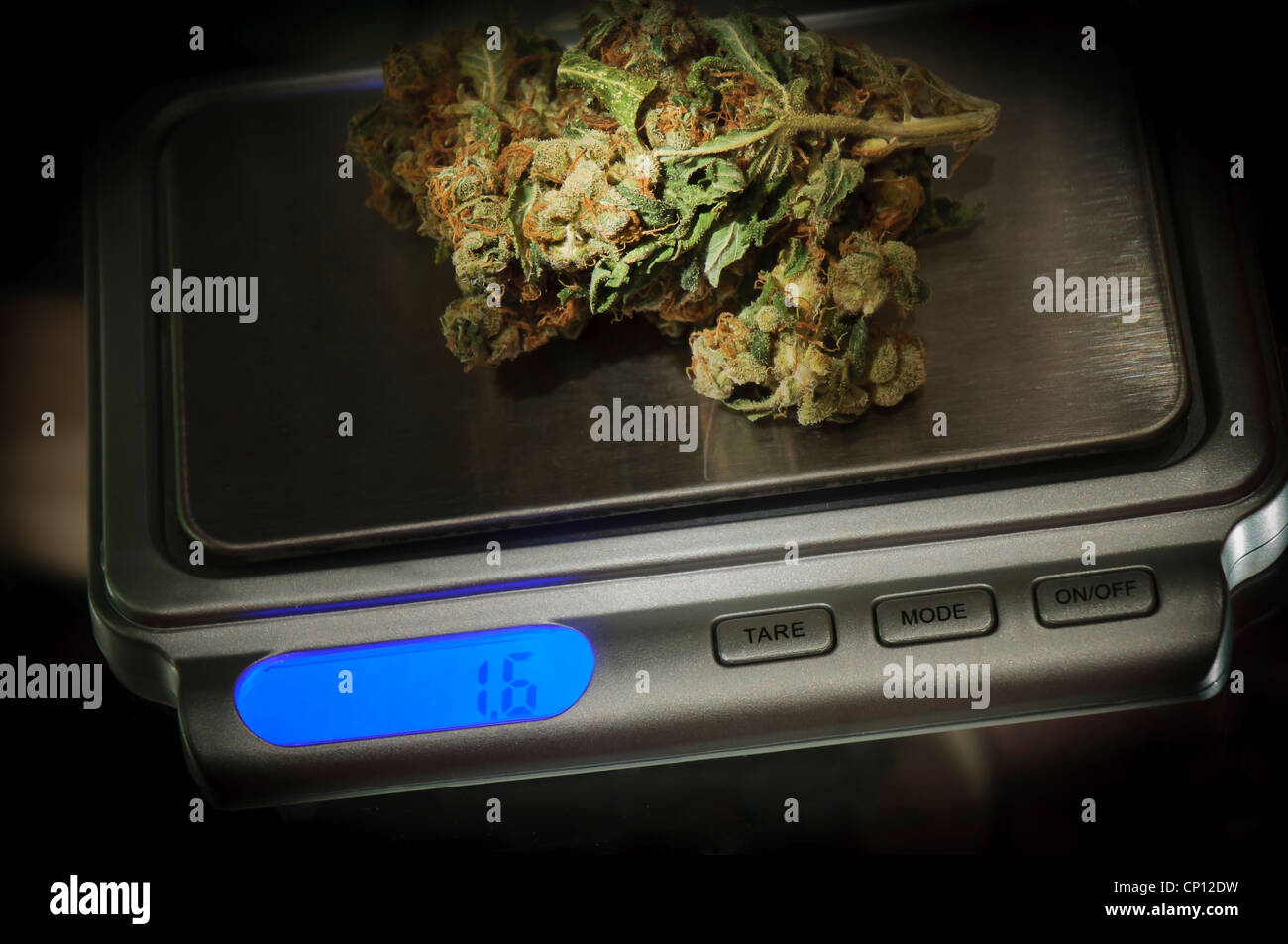 Weed on a marijuana scale weighing to be sold in coffeeshop Stock Photo