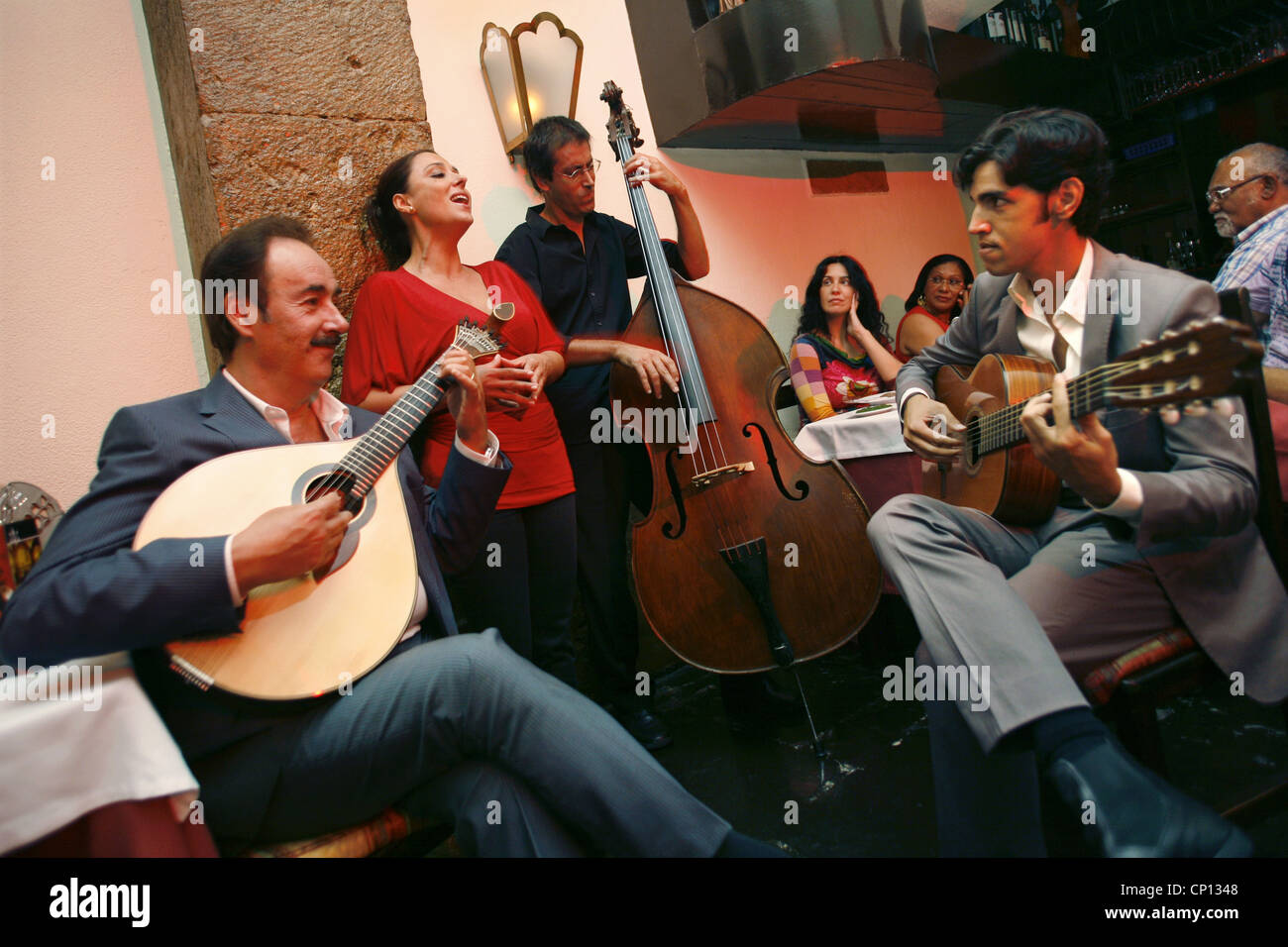 Concert in Clube de Fado, Singer Cristina Nóbrega & Clube de Fado owner / guitarist Mario Pacheco on the left, Lisbon, Portugal Stock Photo