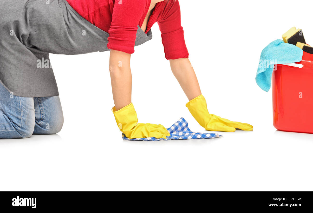 Female cleaner wiping down and bucket with cleaning supplies isolated