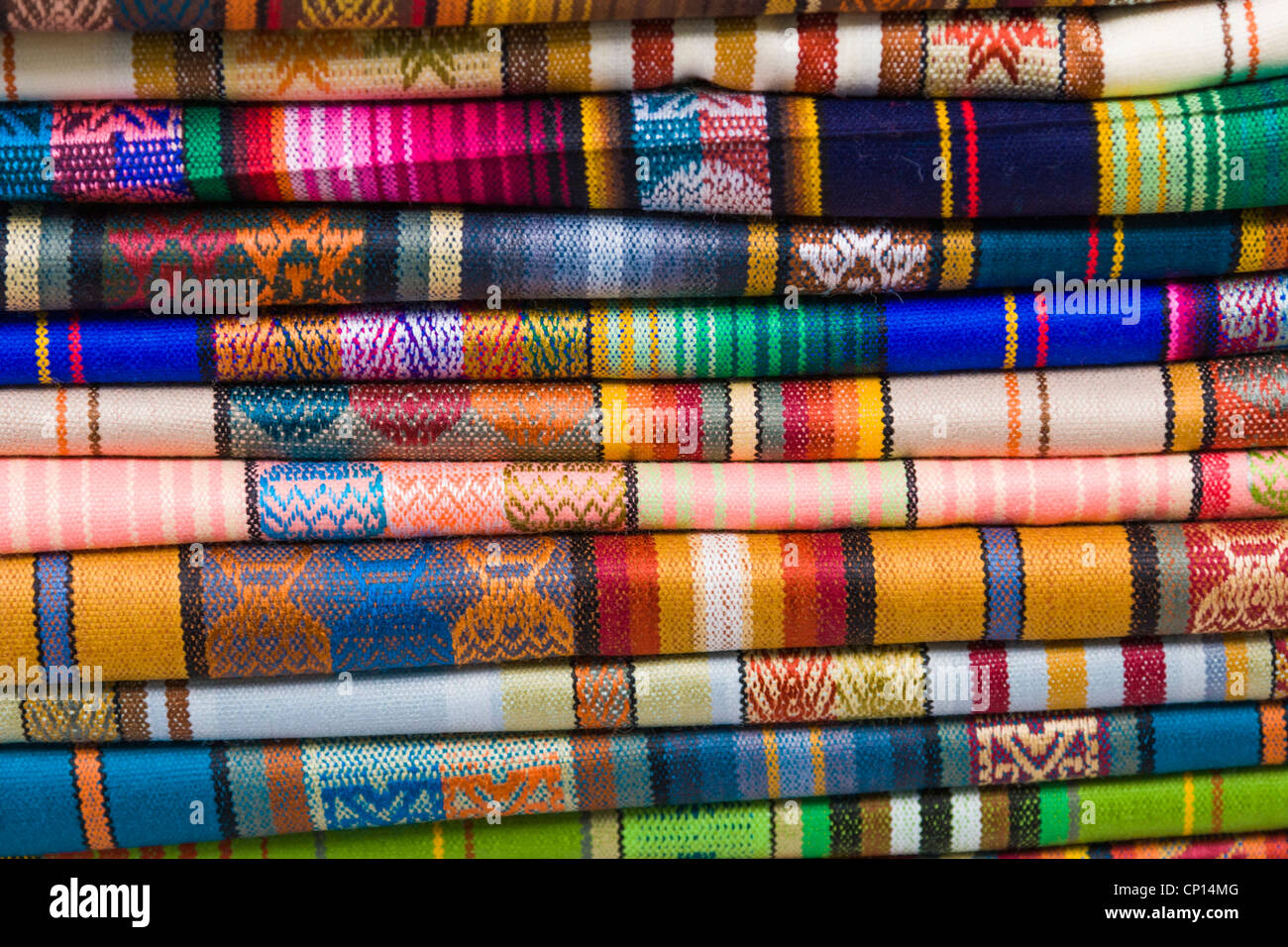 Colorful handmade scarves in shop in market area, Quito, Ecuador. Stock Photo