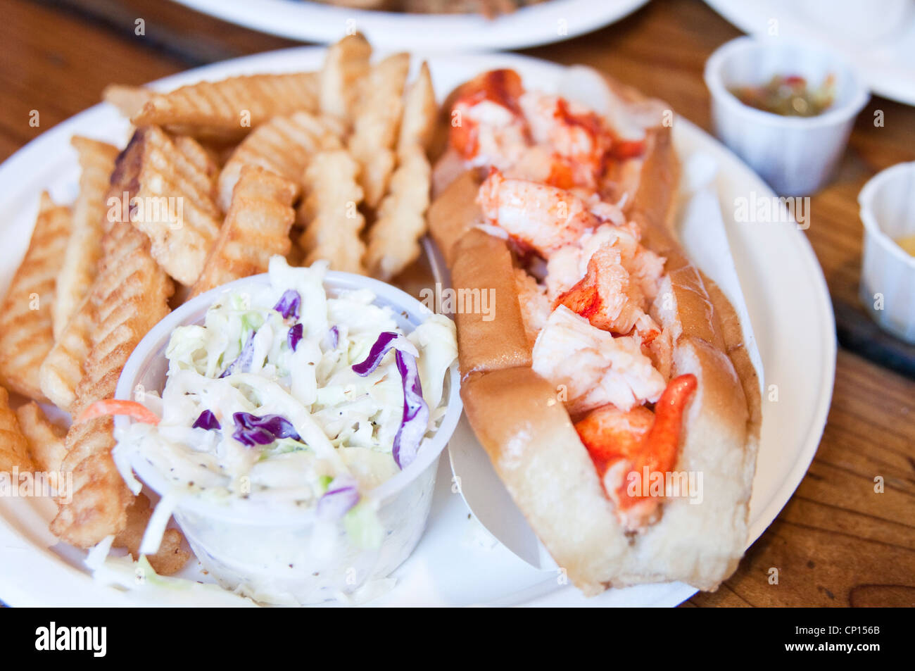 A lobster roll with fries and coleslaw at Lenny & Joe's Fish Tale, a