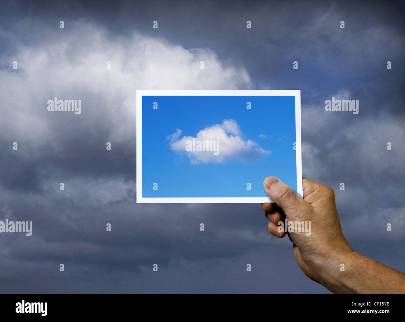 Hand Holding Photograph of Blue Sky over Clouds Stock Photo - Alamy