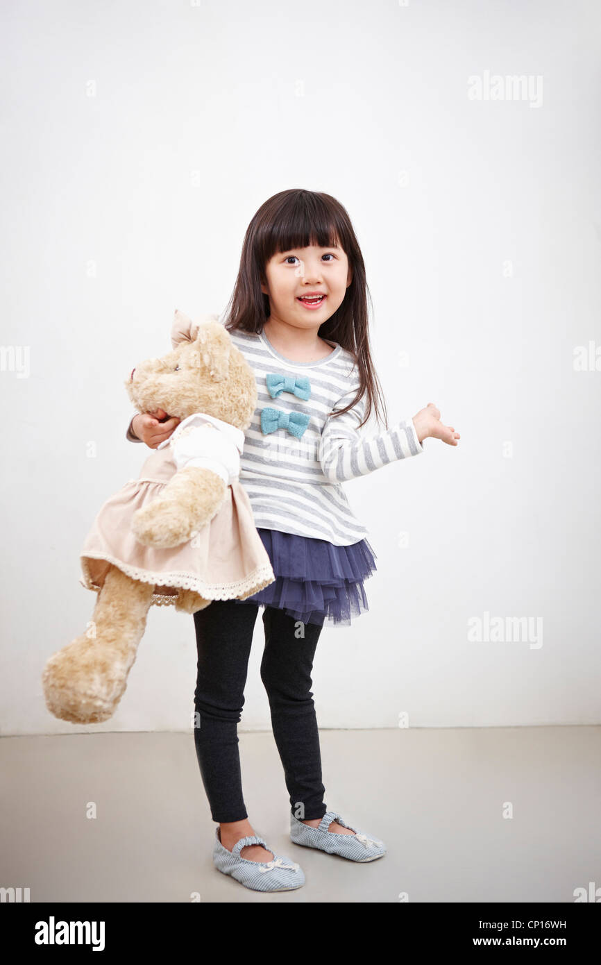 A girl holding teddy bear Stock Photo - Alamy