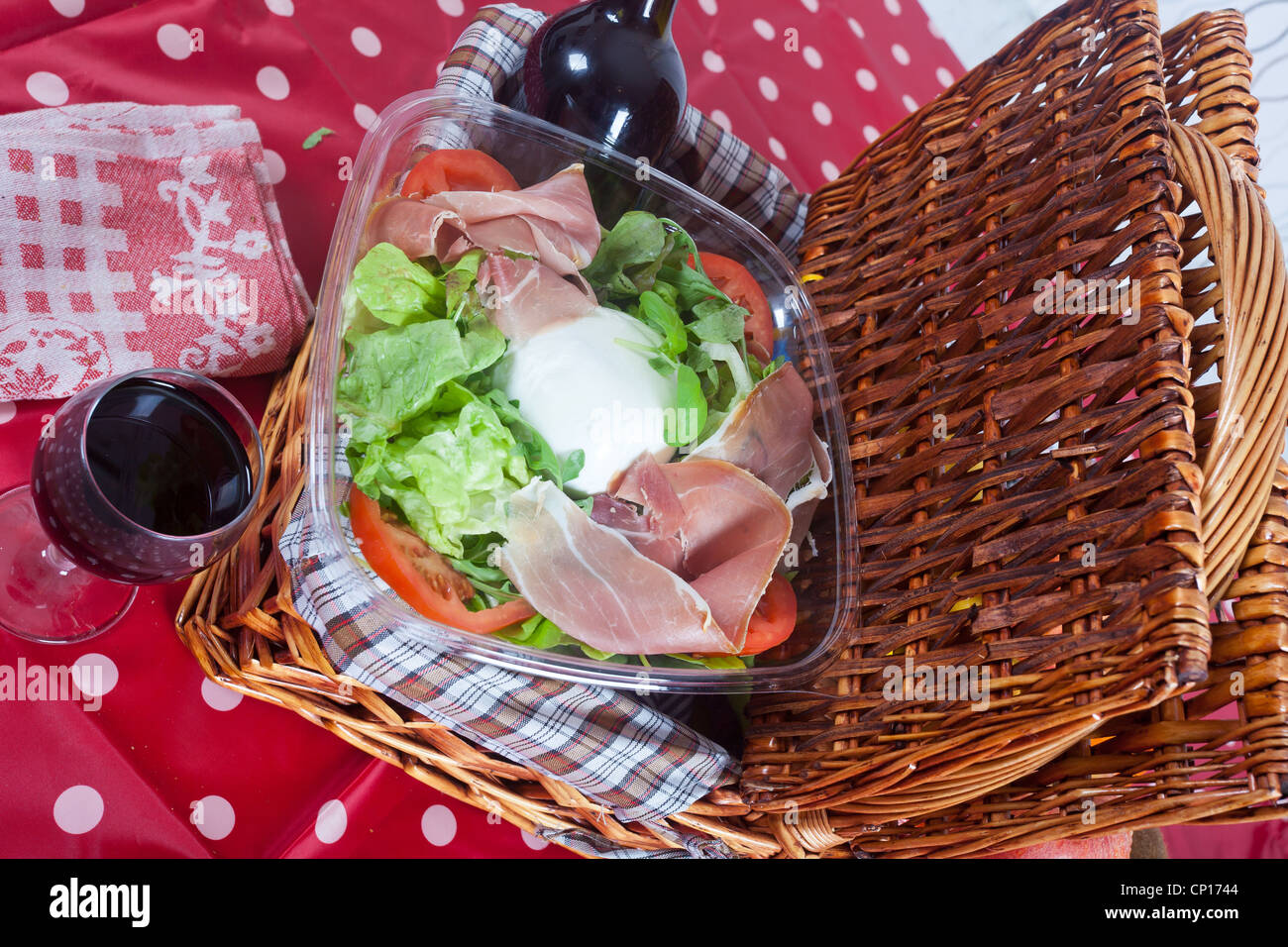 Picnic basket with salad and fruits Stock Photo Alamy