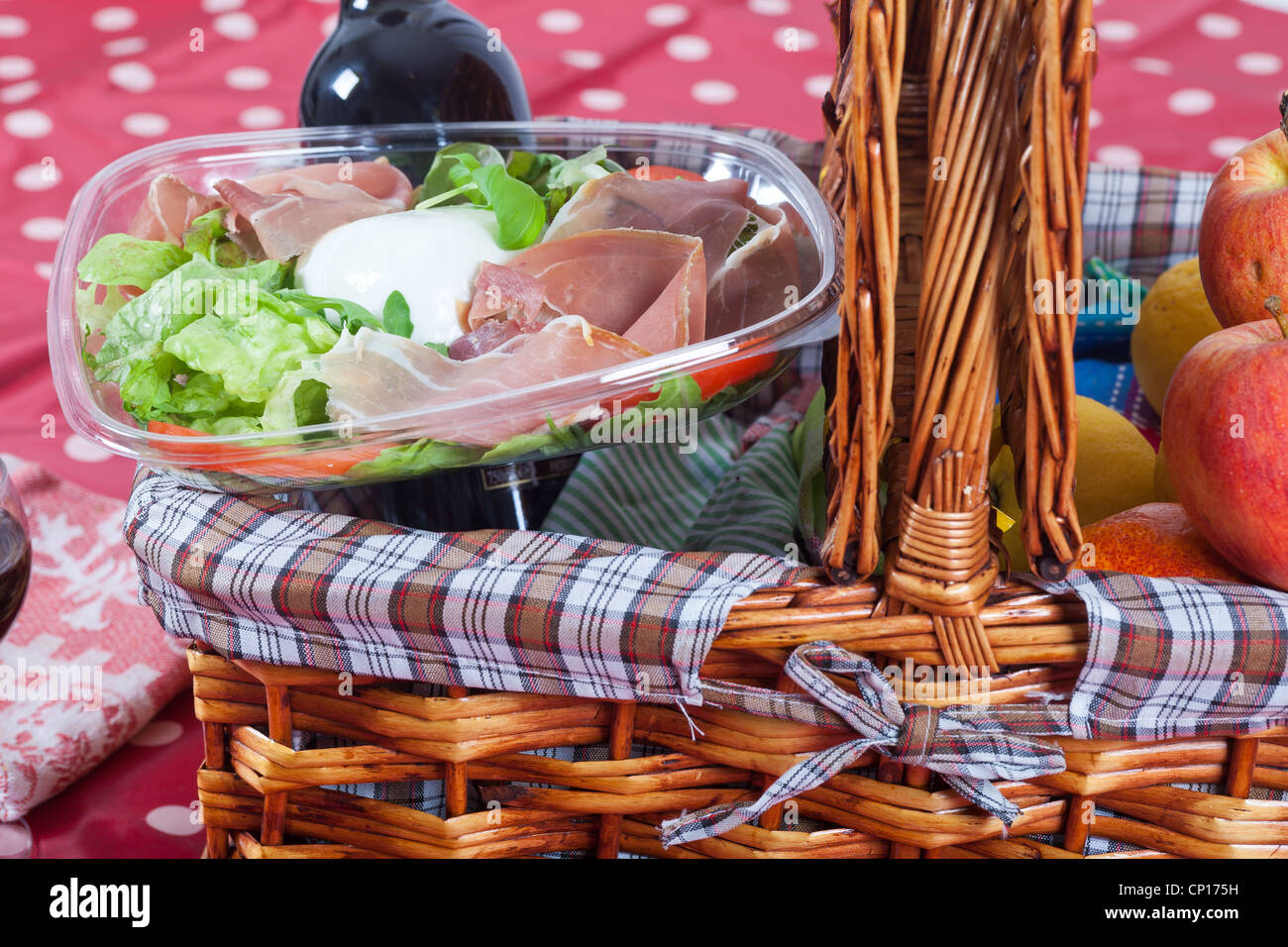 Picnic basket with salad and fruits Stock Photo Alamy