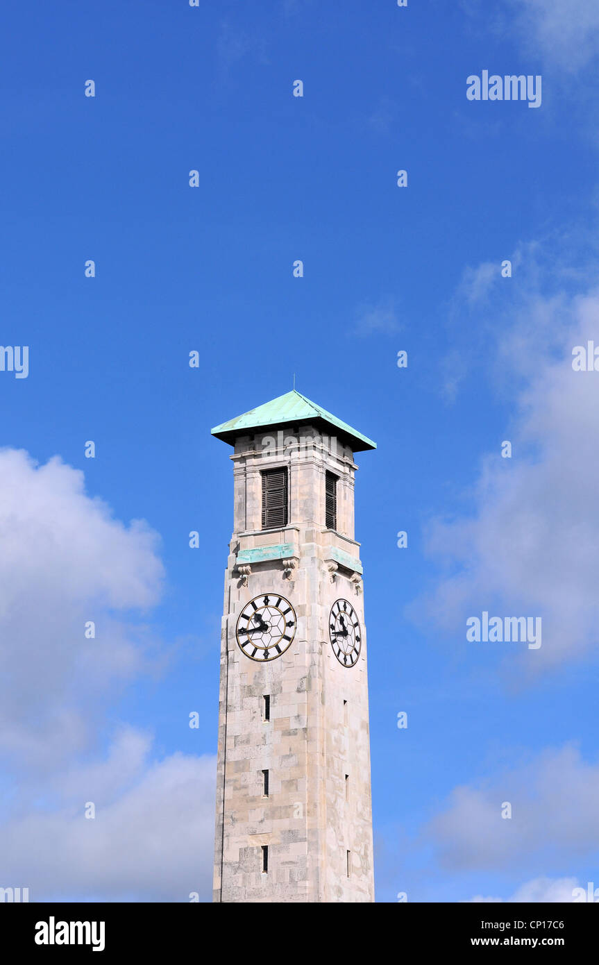 The stone clock tower of the Civic Centre in Southampton, Hampshire, England, in spring sunshine with blue sky and cloud behind. Stock Photo