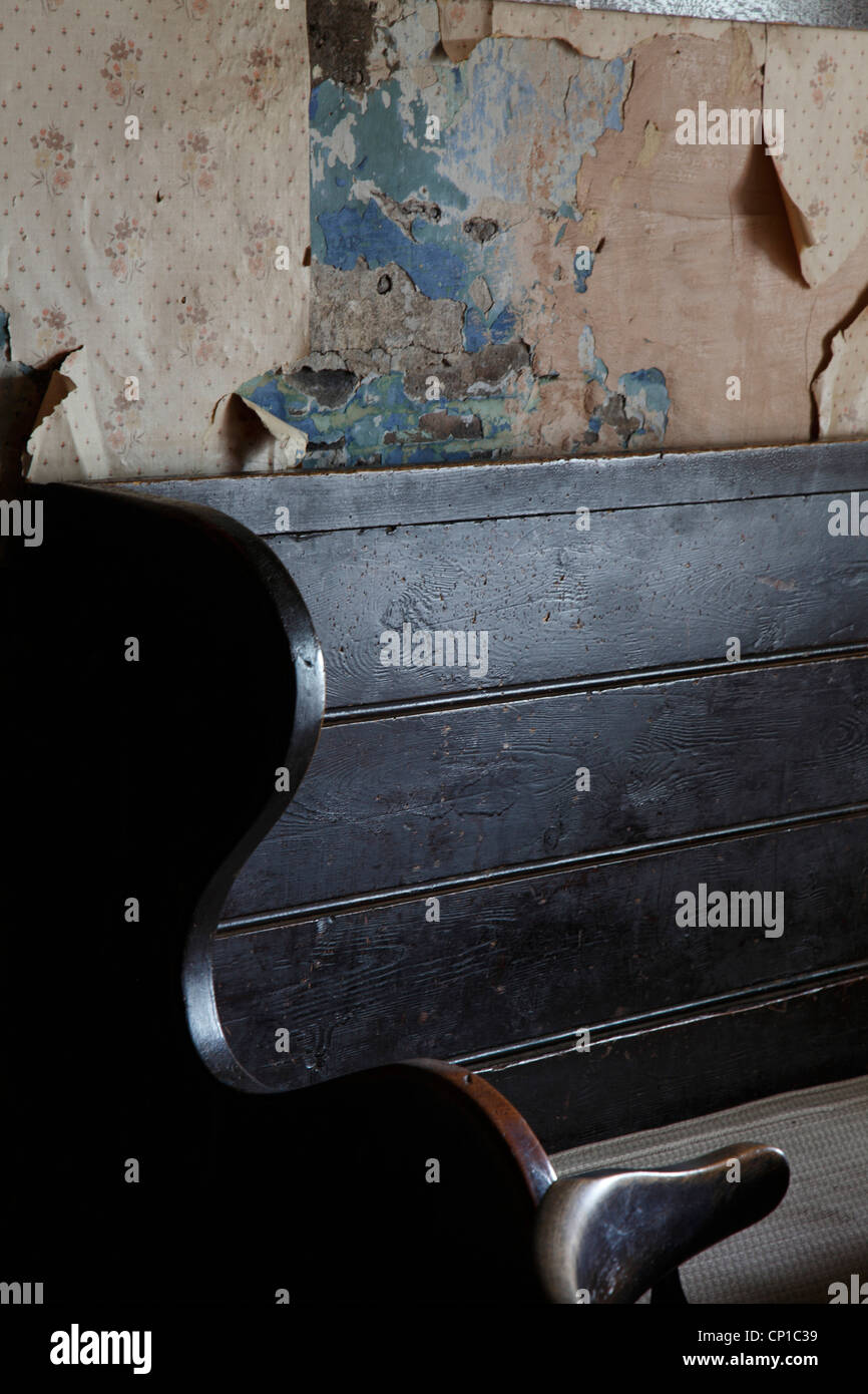 Pub seating with distressed wallpaper, Craswall, Herefordshire, UK. Stock Photo