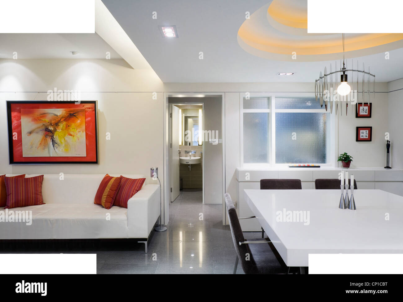 open plan livingroom with dining talbe in a modern apartment stock
