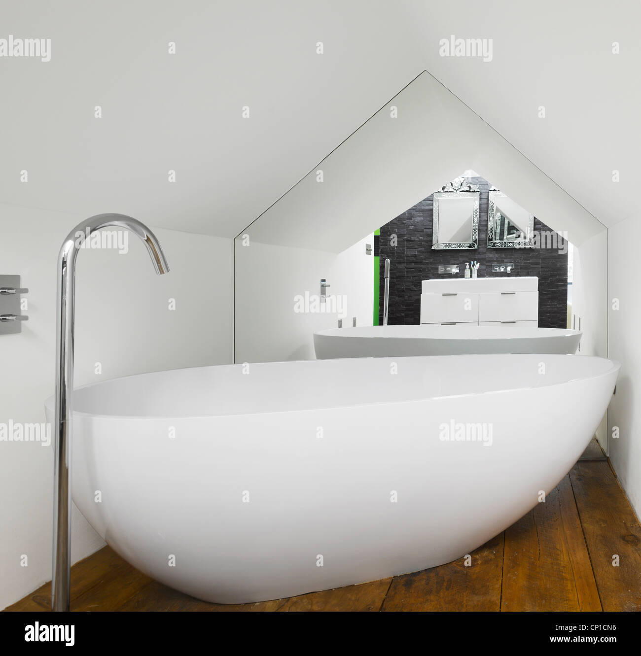 Bath under roof eaves of loft extension Stock Photo Alamy