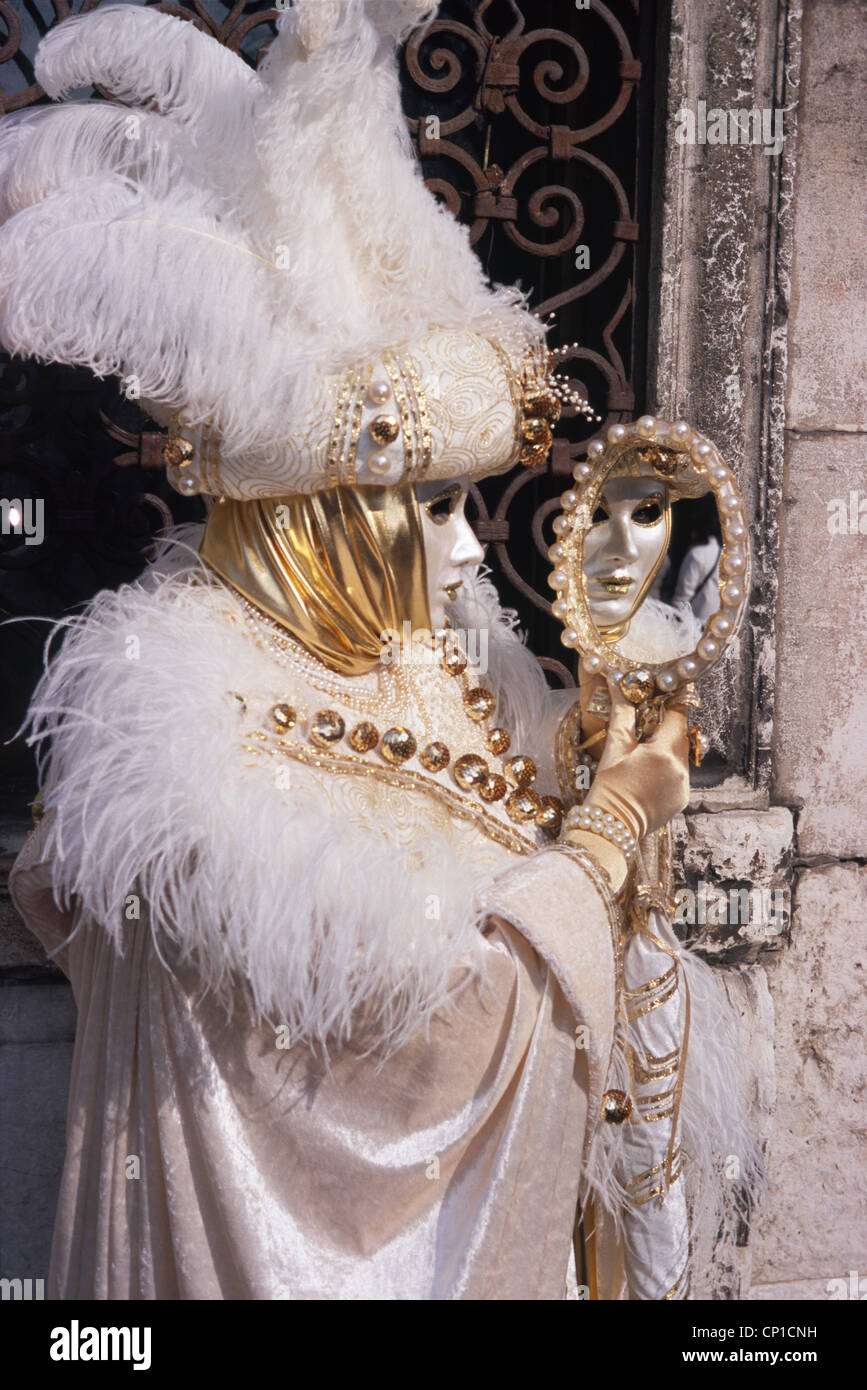 Carnevale Venezia: White and golden mask with Mirror Stock Photo