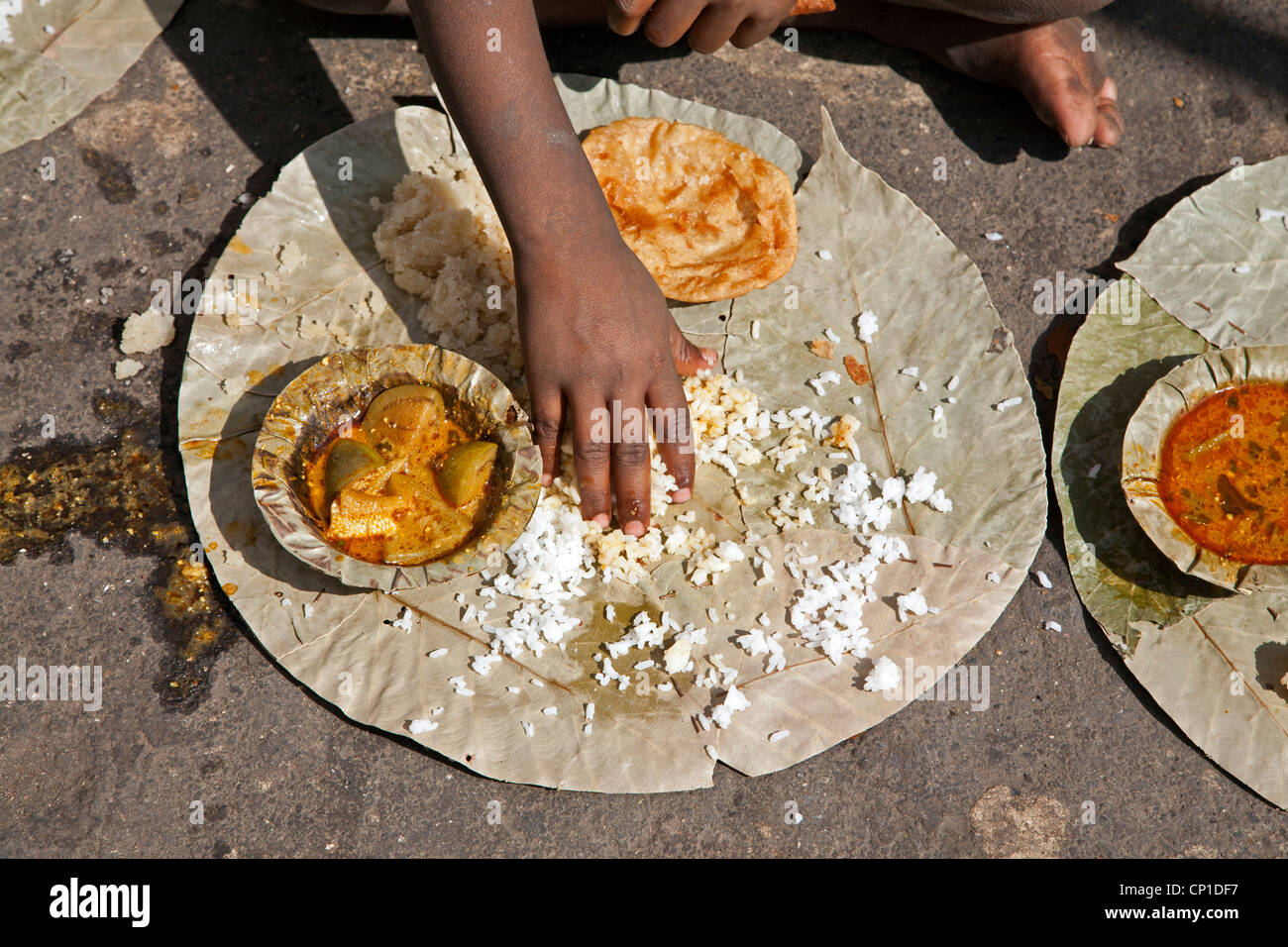 Boy eating a thali (traditional indian meal). Nasik. India Stock Photo