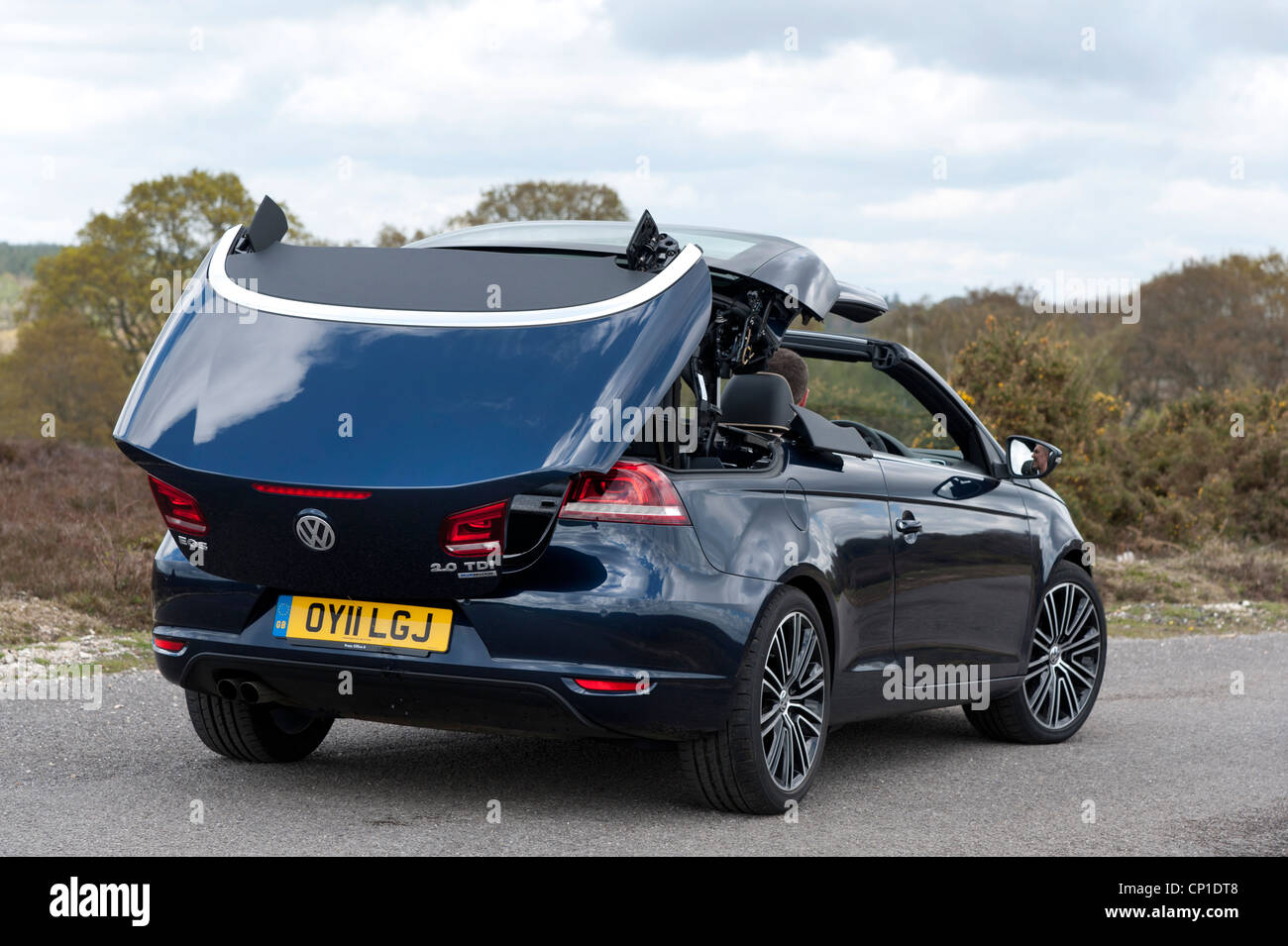 Lowering convertible car roof hires stock photography and images Alamy