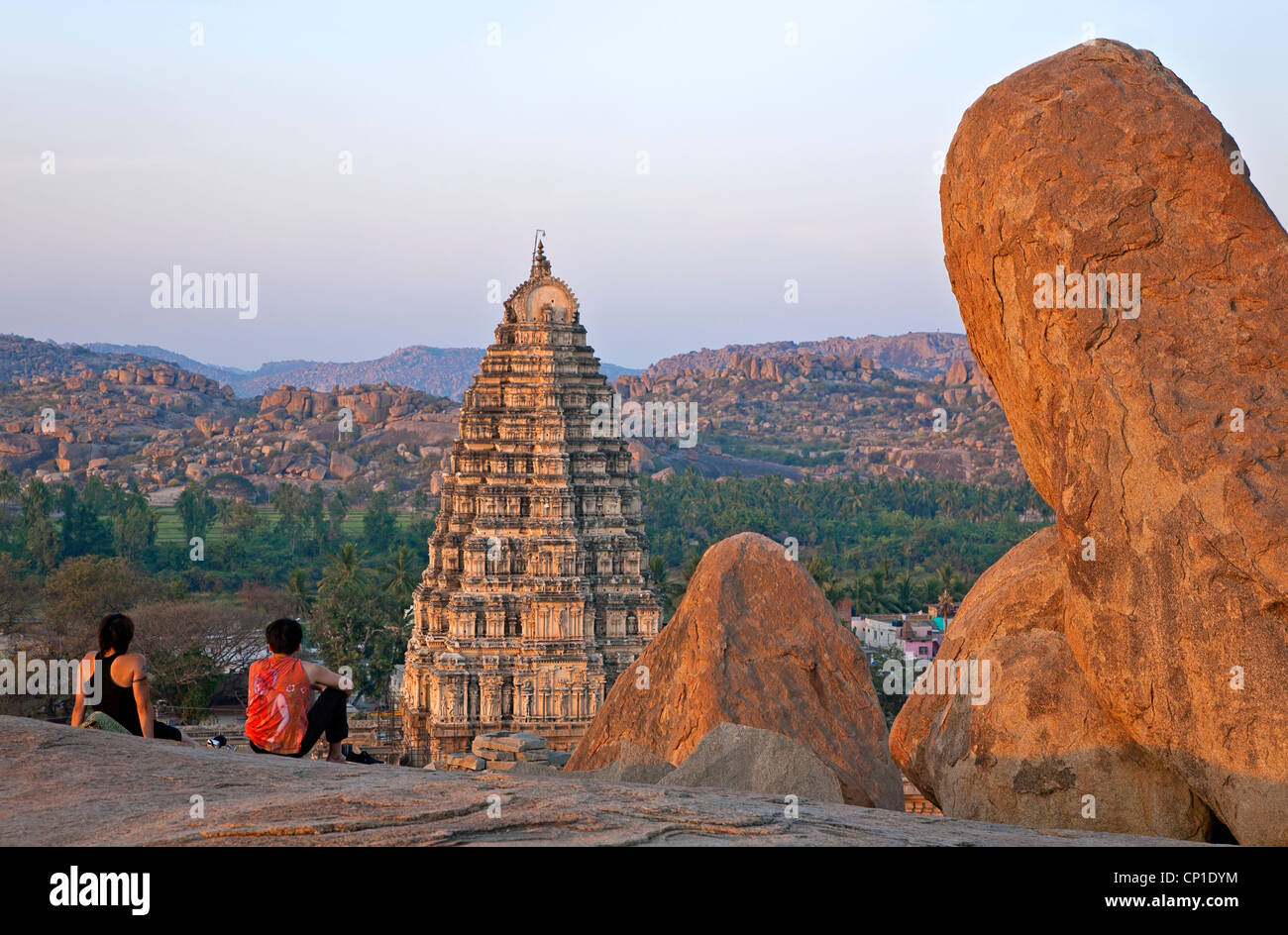 Tourists contemplating the Virupaksha temple. Hampi. Karnataka. India Stock Photo