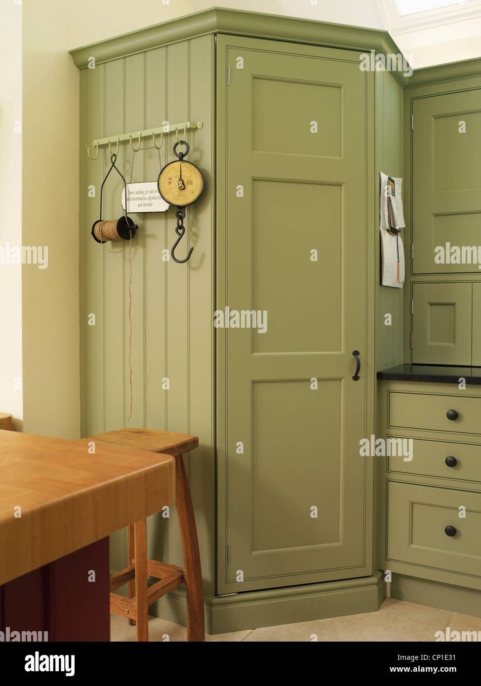 Built in green kitchen units Stock Photo Alamy