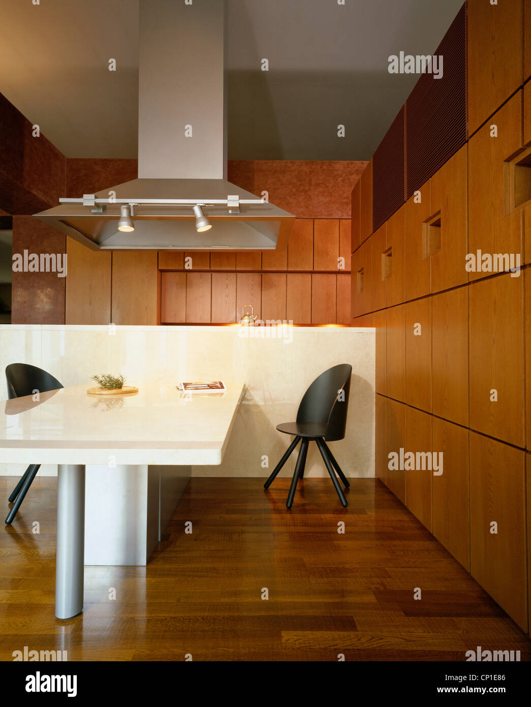 Extractor fan over central island unit in contemporary kitchen Stock Photo Alamy