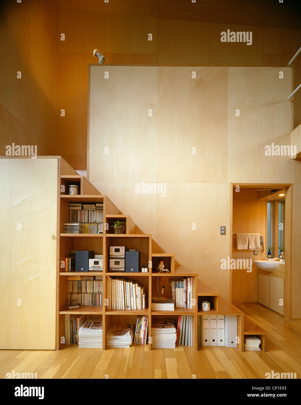 Storage cubes with view of bathroom beyond Stock Photo Alamy