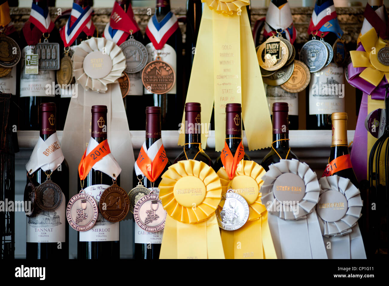 Shelves of award winning wine bottles with prize ribbons Stock Photo