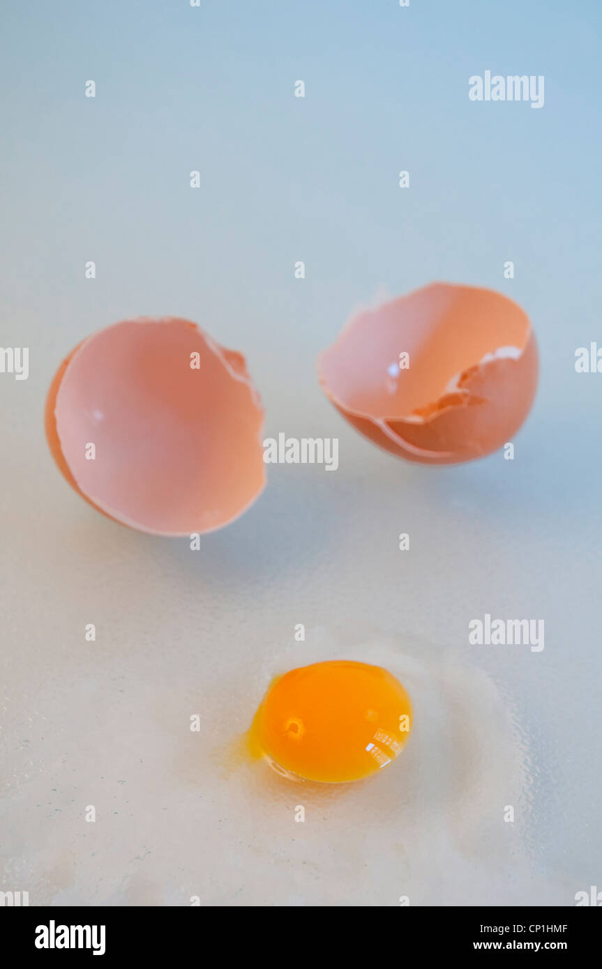 Cracked egg with a small yolk Stock Photo Alamy