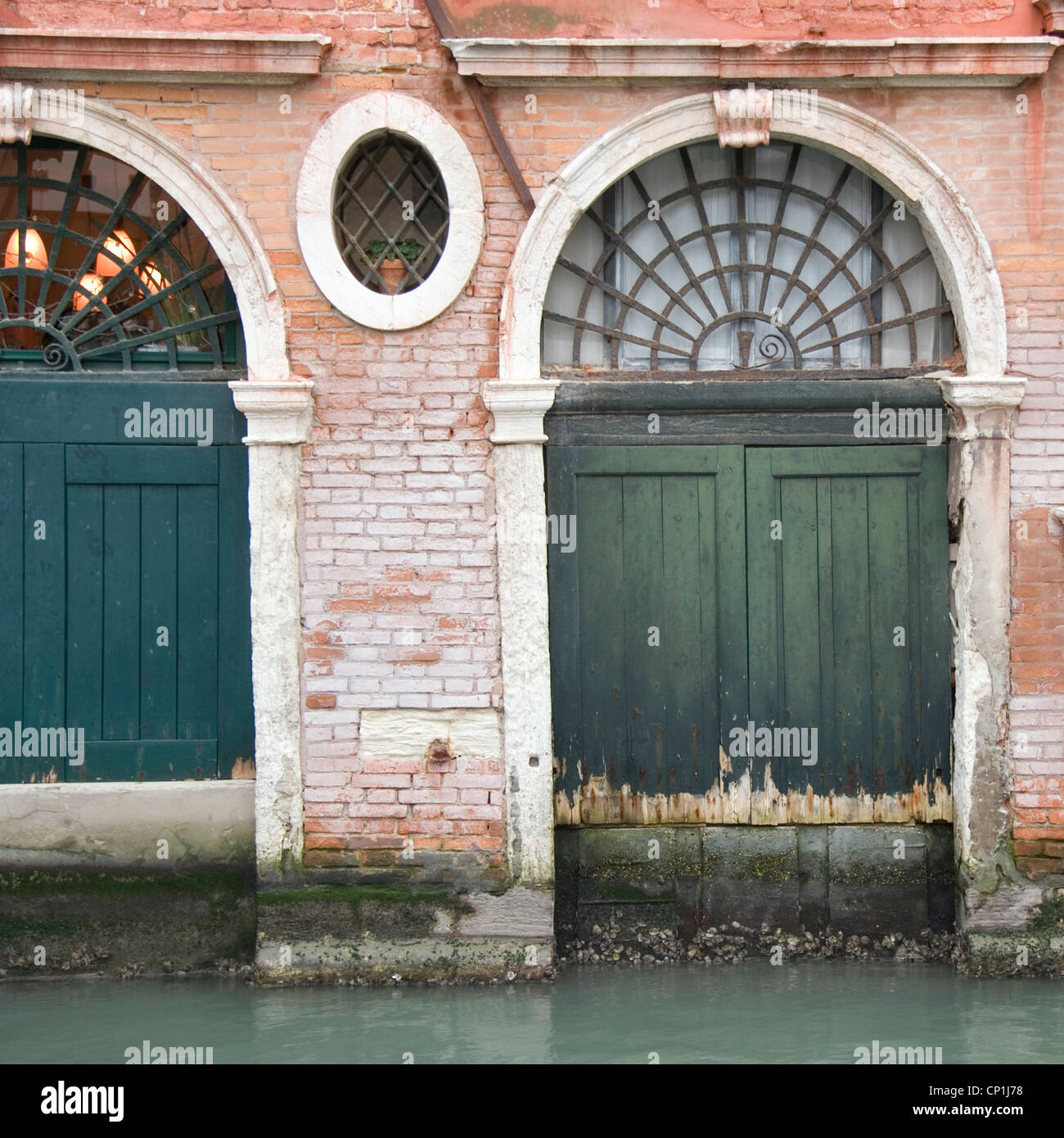 Arched doorways, Venice building exterior. Stock Photo