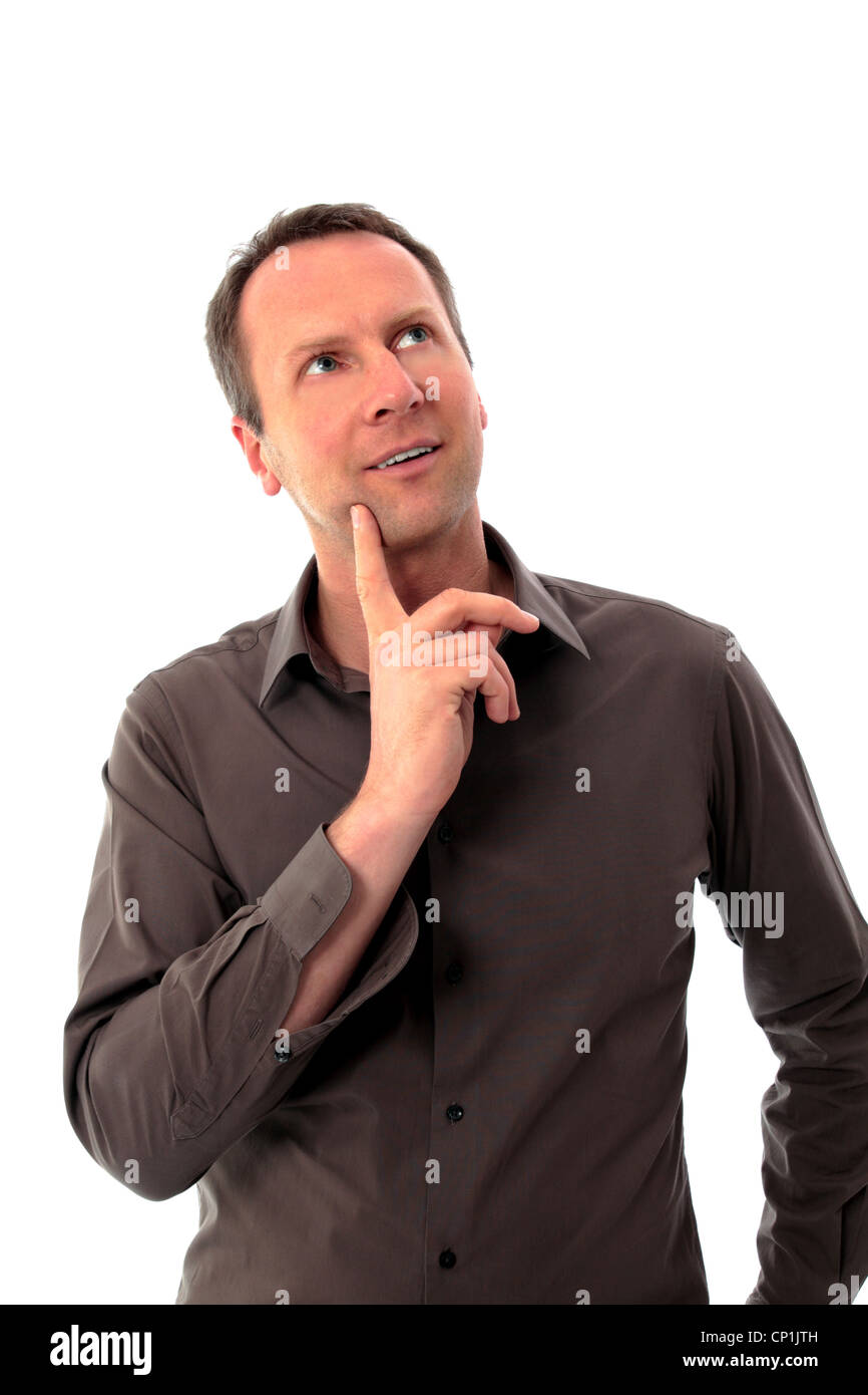 Man thinking with finger on his chin Stock Photo