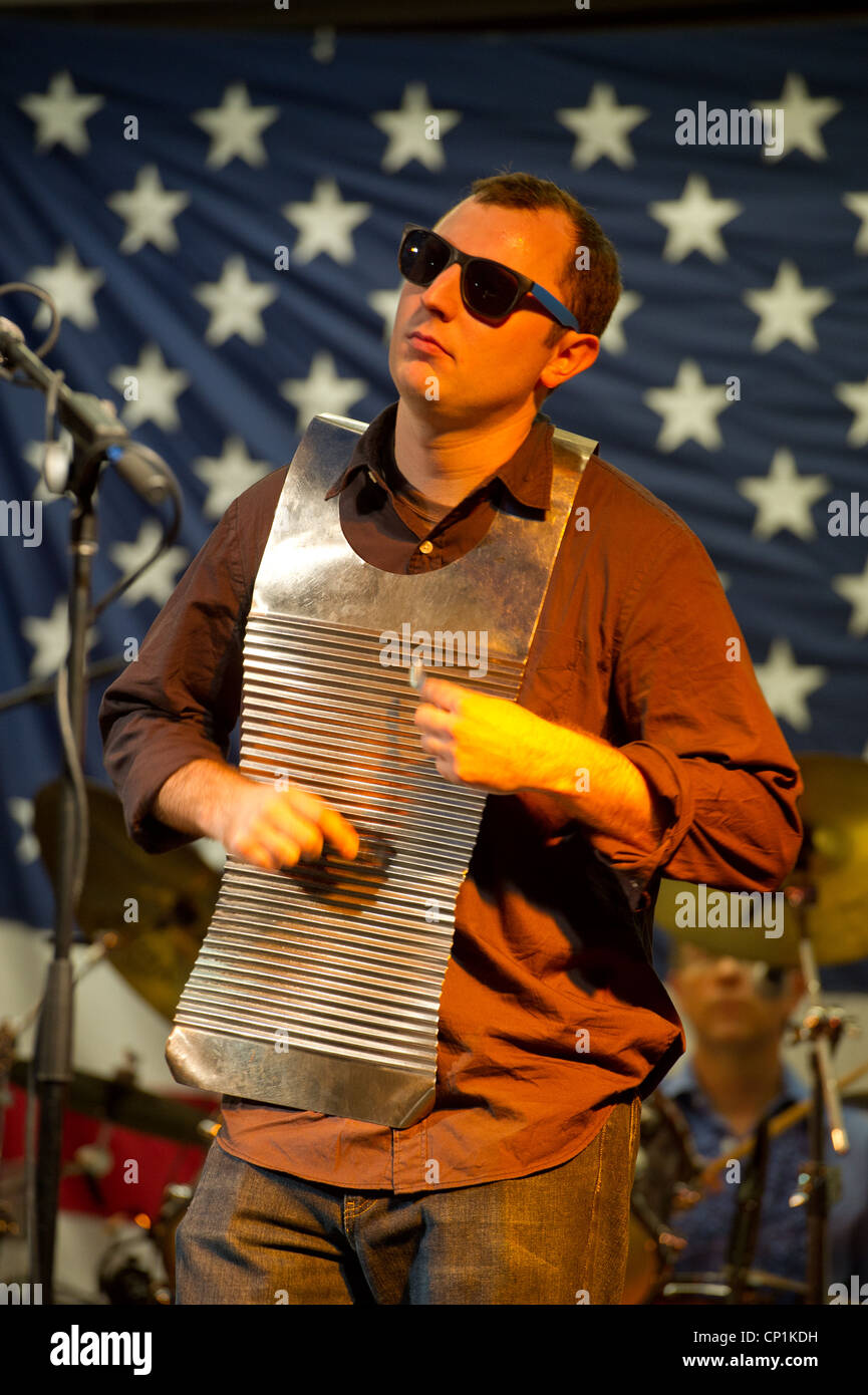 Man playing washboard and spoons on stage in a band Stock Photo ...